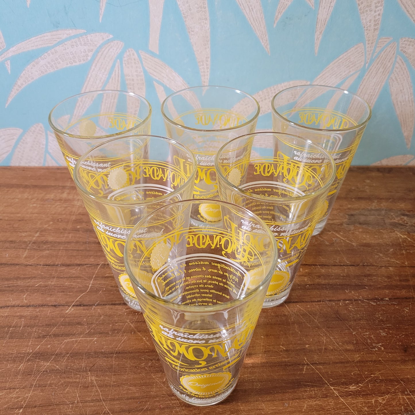 Set of six vintage French 'Limonade Original' yellow lemonade glasses