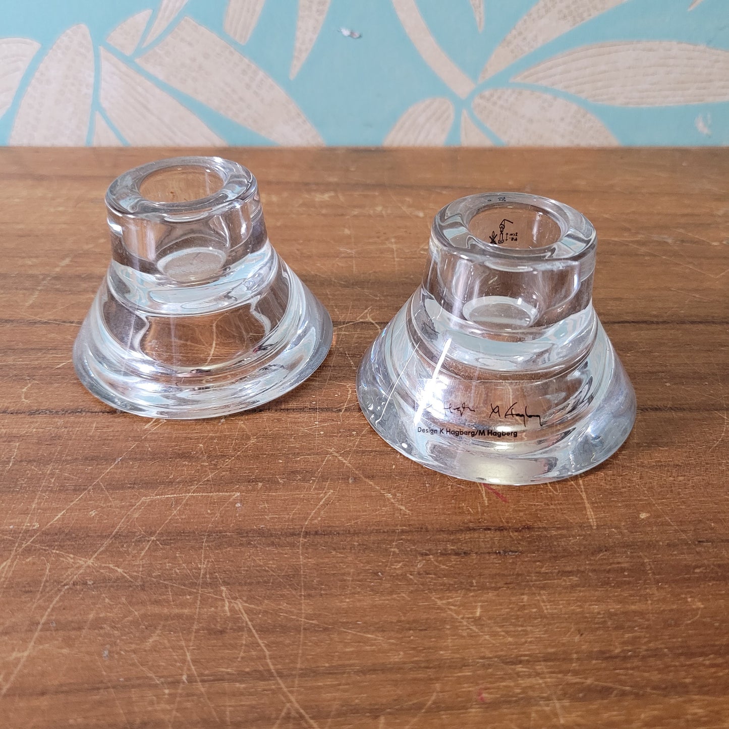 Two collectable Hagberg glass reversible tea light/candle holders