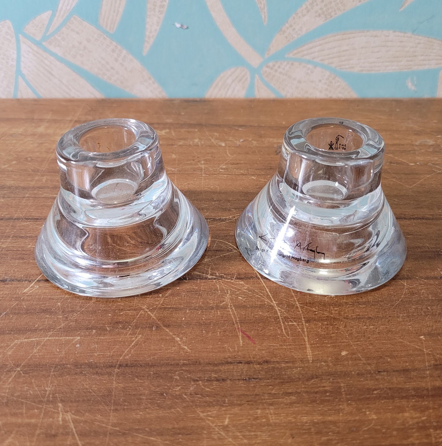 Two collectable Hagberg glass reversible tea light/candle holders
