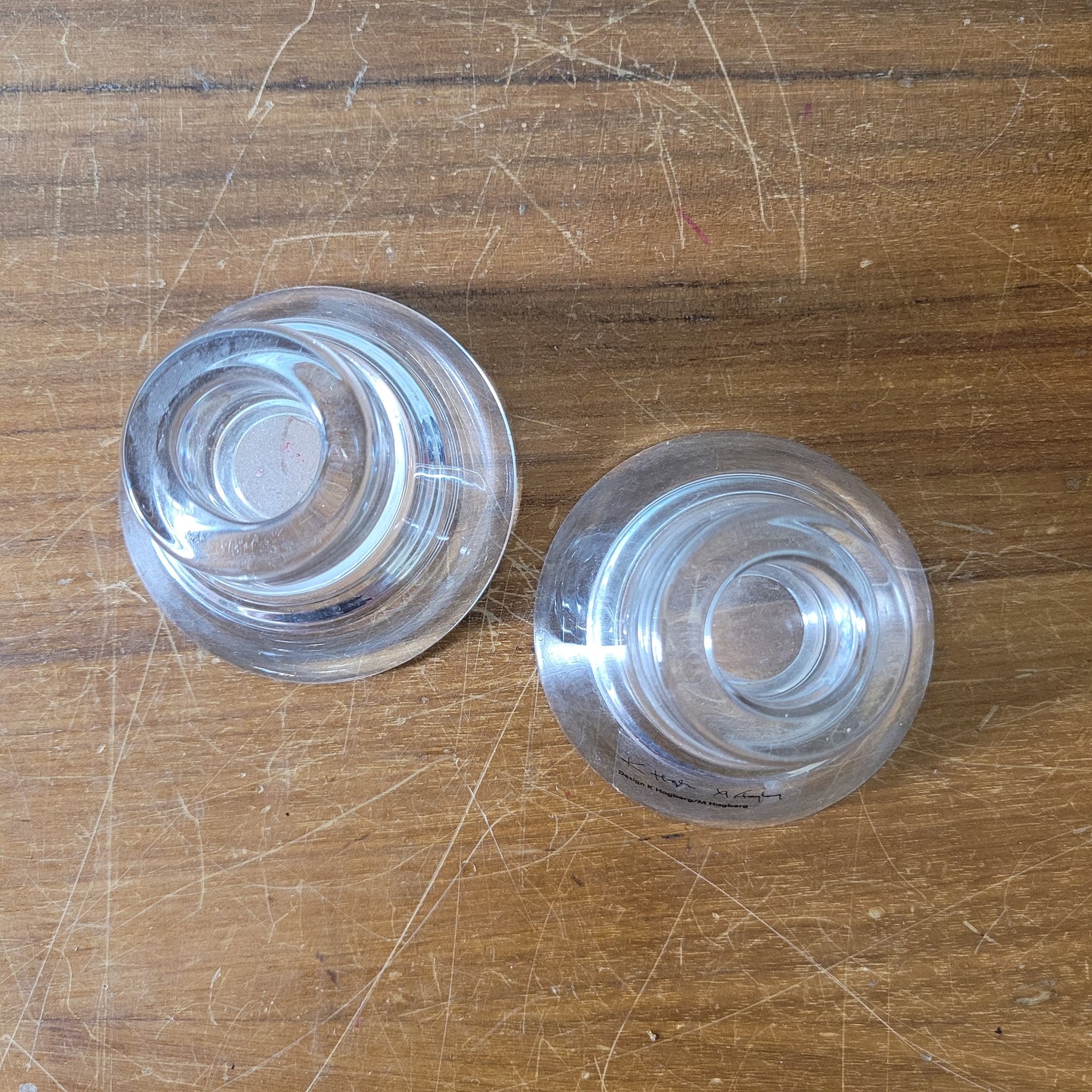 Two collectable Hagberg glass reversible tea light/candle holders