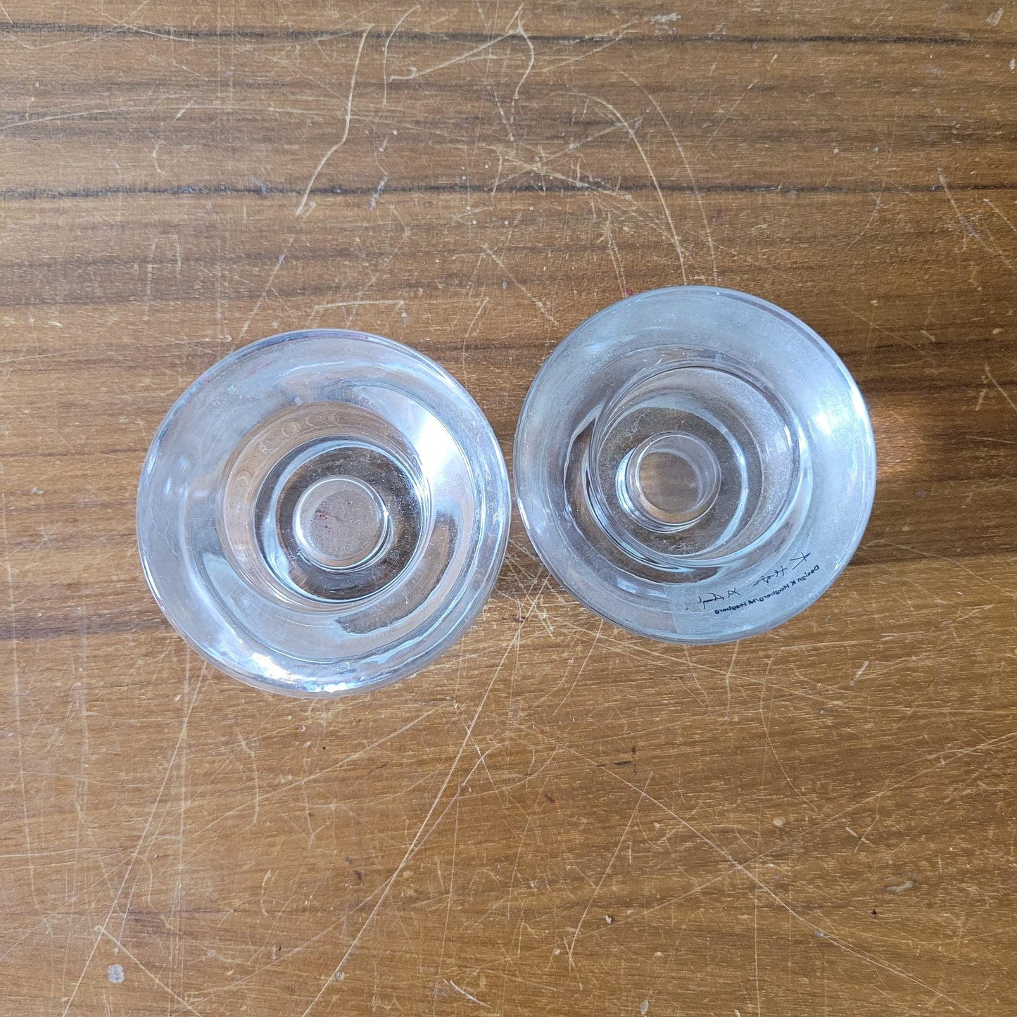 Two collectable Hagberg glass reversible tea light/candle holders