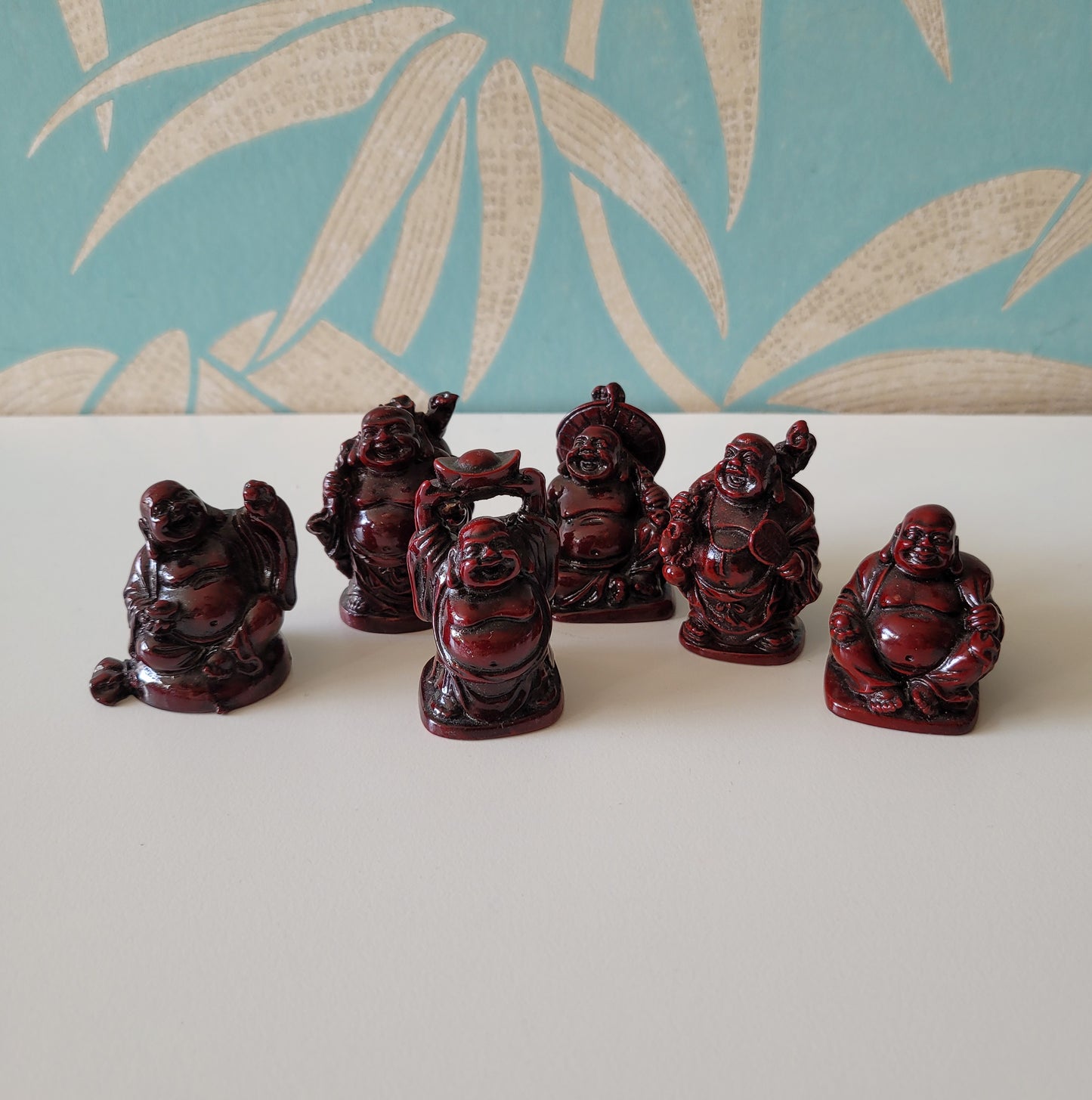 Set of six kitsch miniature resin lucky Buddha figurines