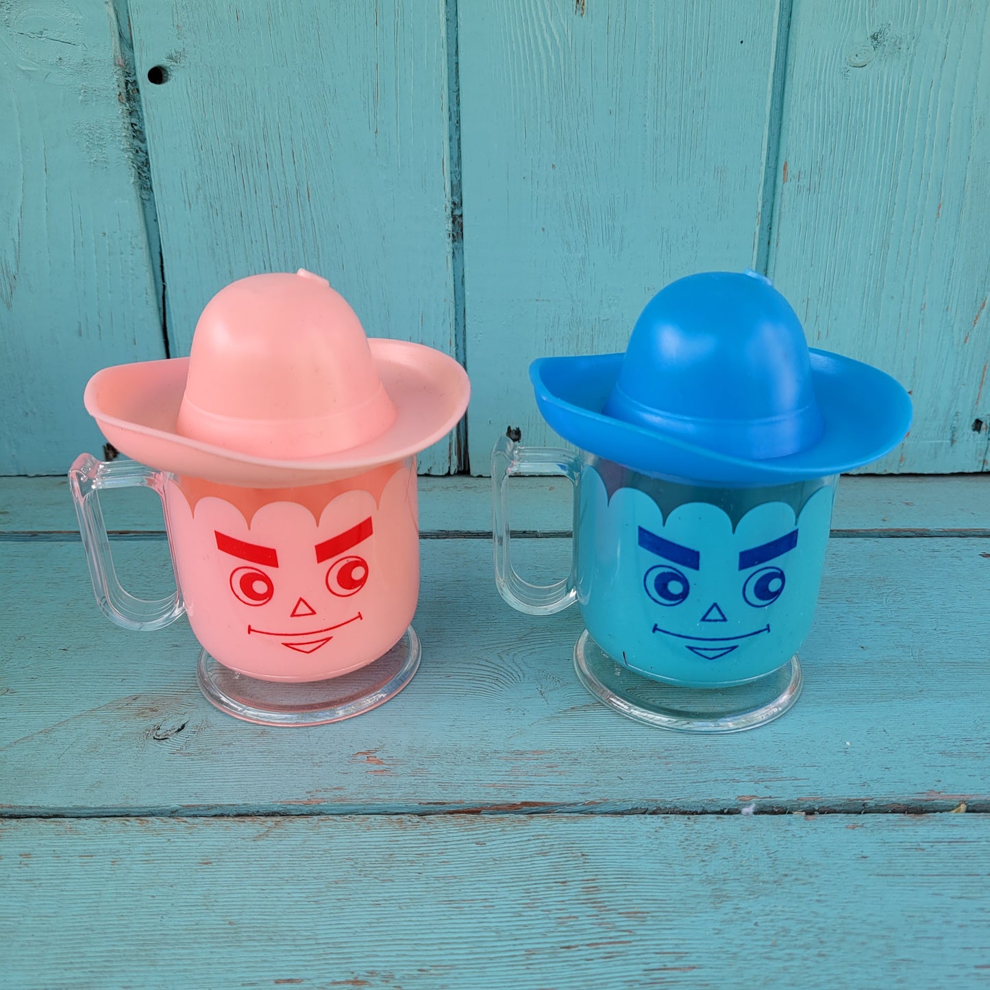 Two vintage plastic 'Hat' cups, with original packaging, in pink & blue