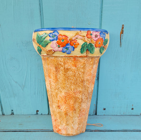 Art Deco Wadeheath Ware orange/rust ceramic wall planter with handpainted floral rim, stamped 224