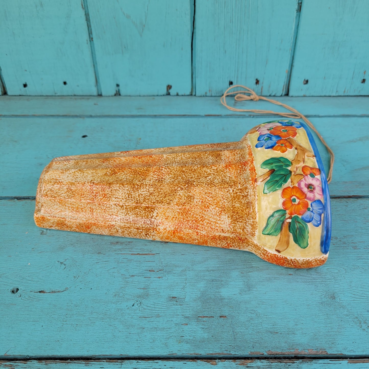 Art Deco Wadeheath Ware orange/rust ceramic wall planter with handpainted floral rim, stamped 224