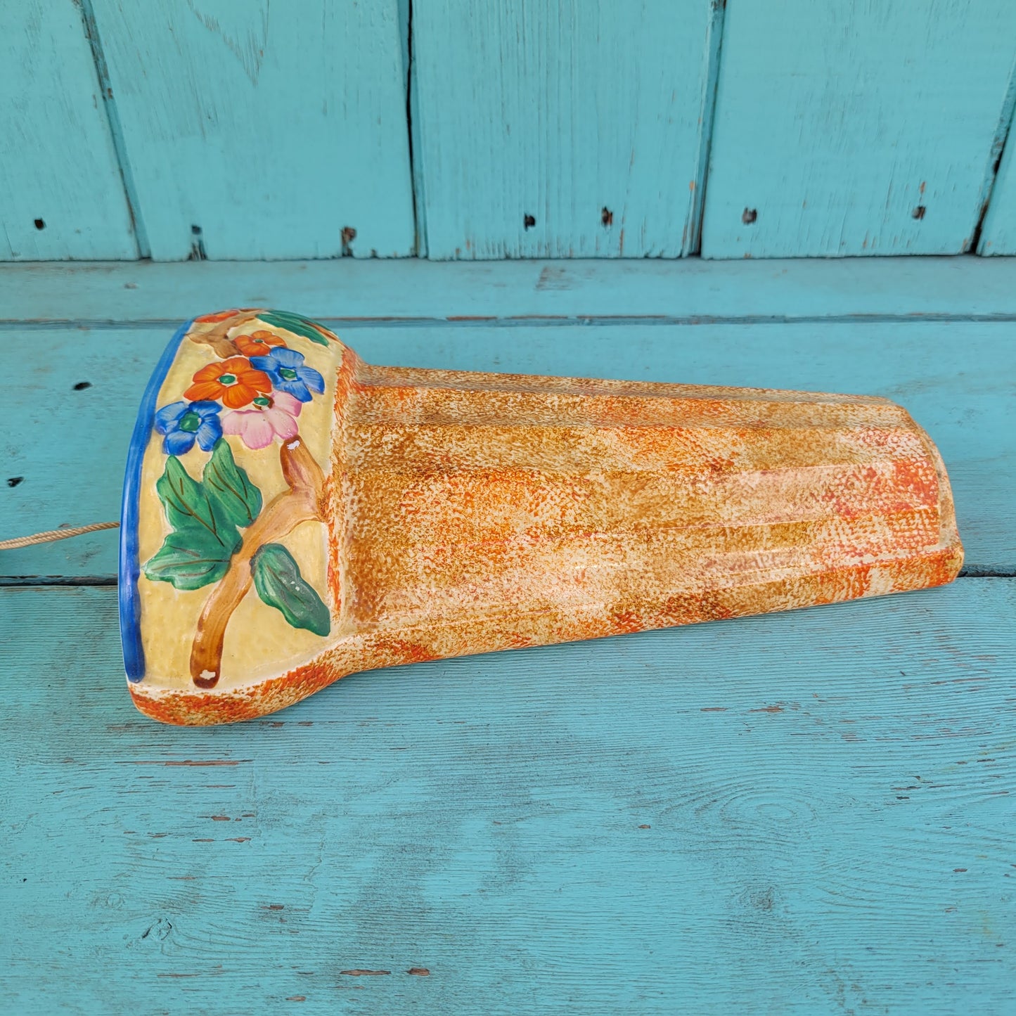 Art Deco Wadeheath Ware orange/rust ceramic wall planter with handpainted floral rim, stamped 224