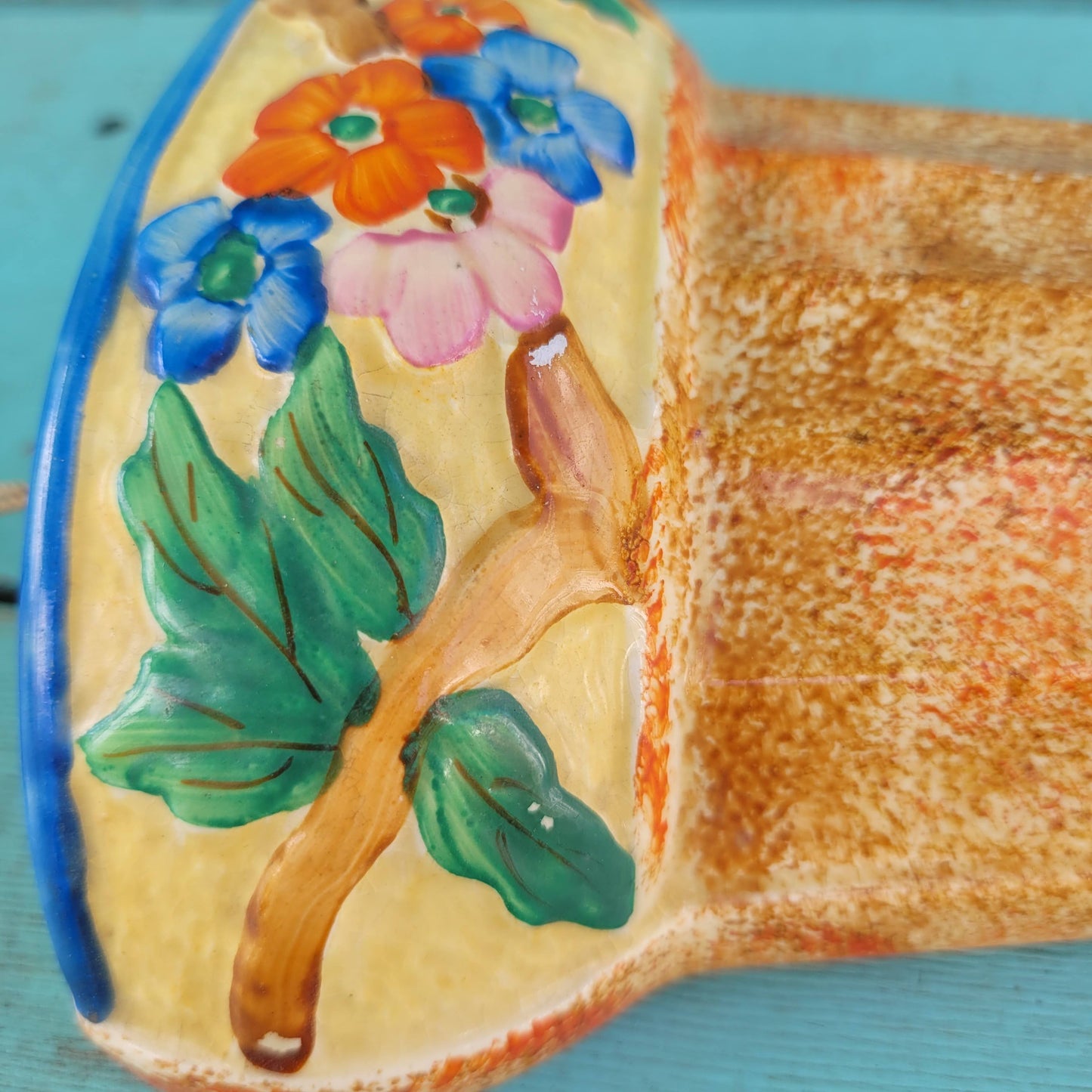 Art Deco Wadeheath Ware orange/rust ceramic wall planter with handpainted floral rim, stamped 224