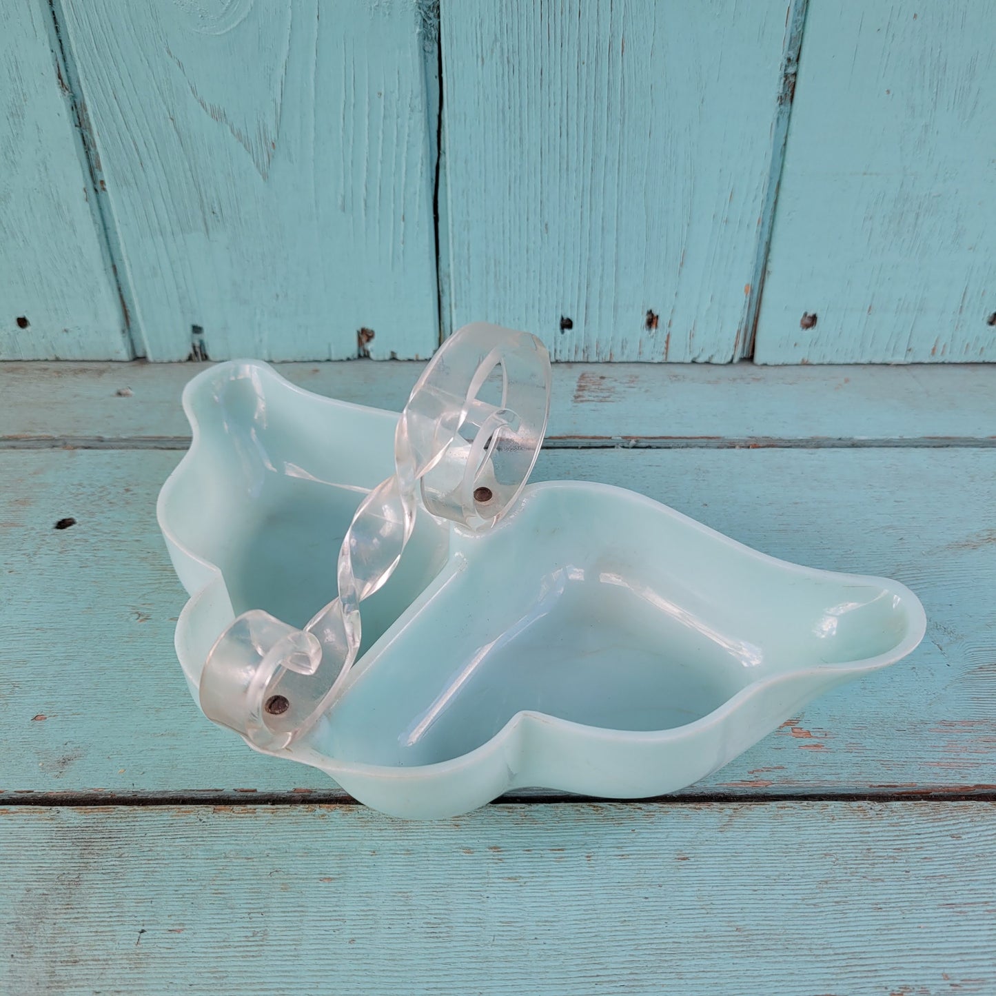 circa. late 1940s pale turquoise acrylic butterfly shaped trinket dish with scroll-shaped handle