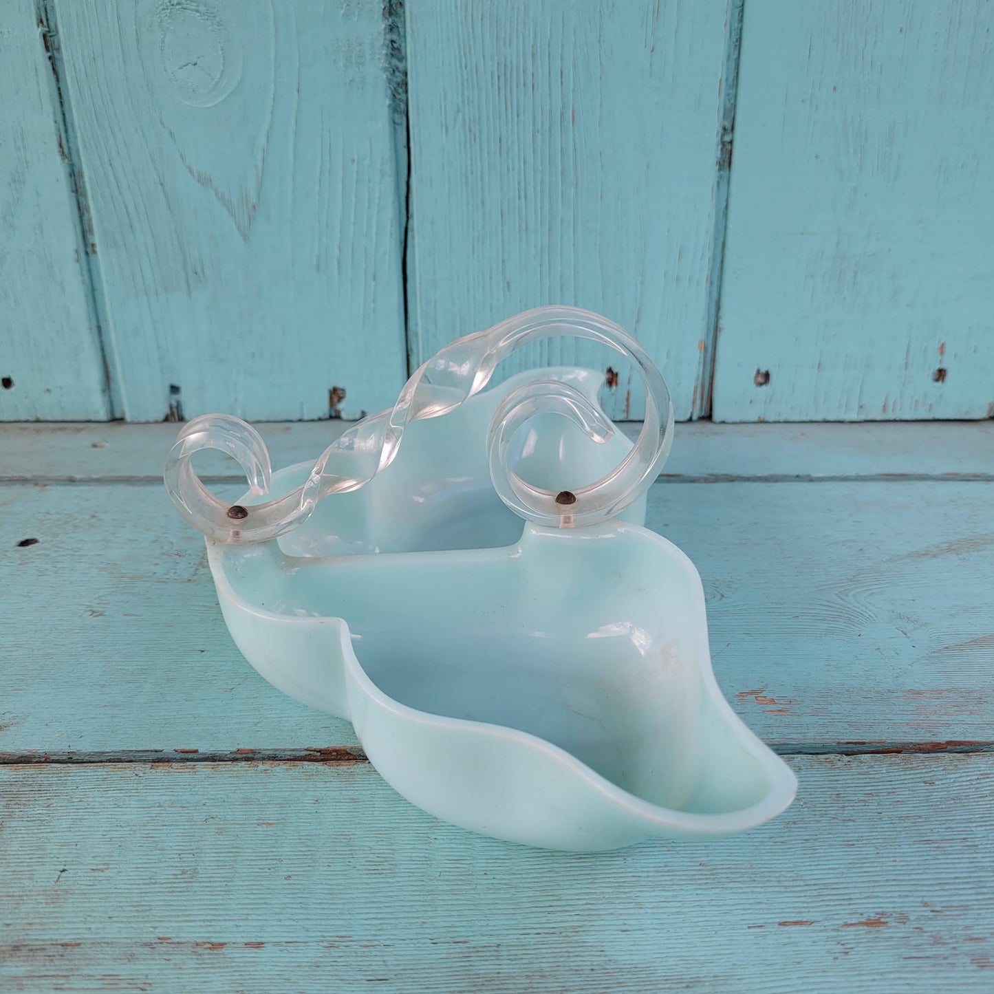 circa. late 1940s pale turquoise acrylic butterfly shaped trinket dish with scroll-shaped handle