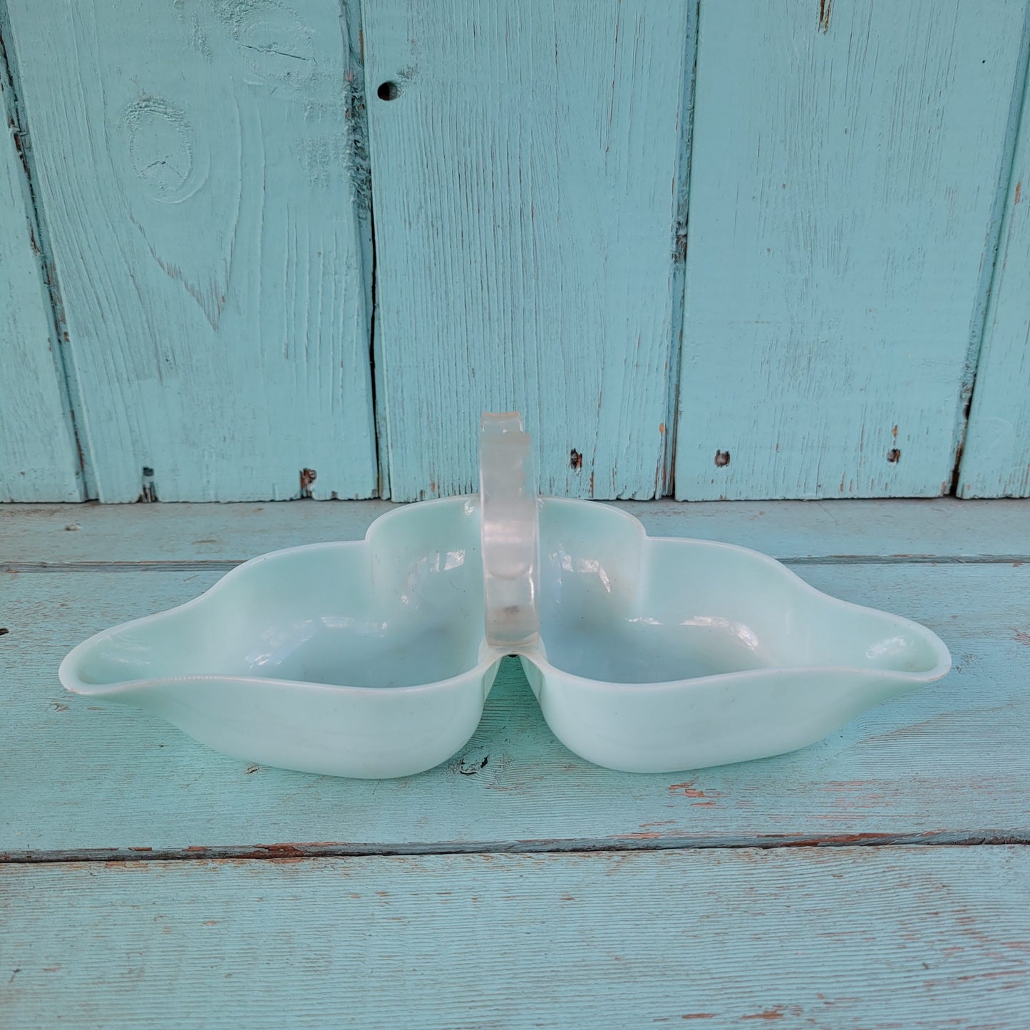 circa. late 1940s pale turquoise acrylic butterfly shaped trinket dish with scroll-shaped handle