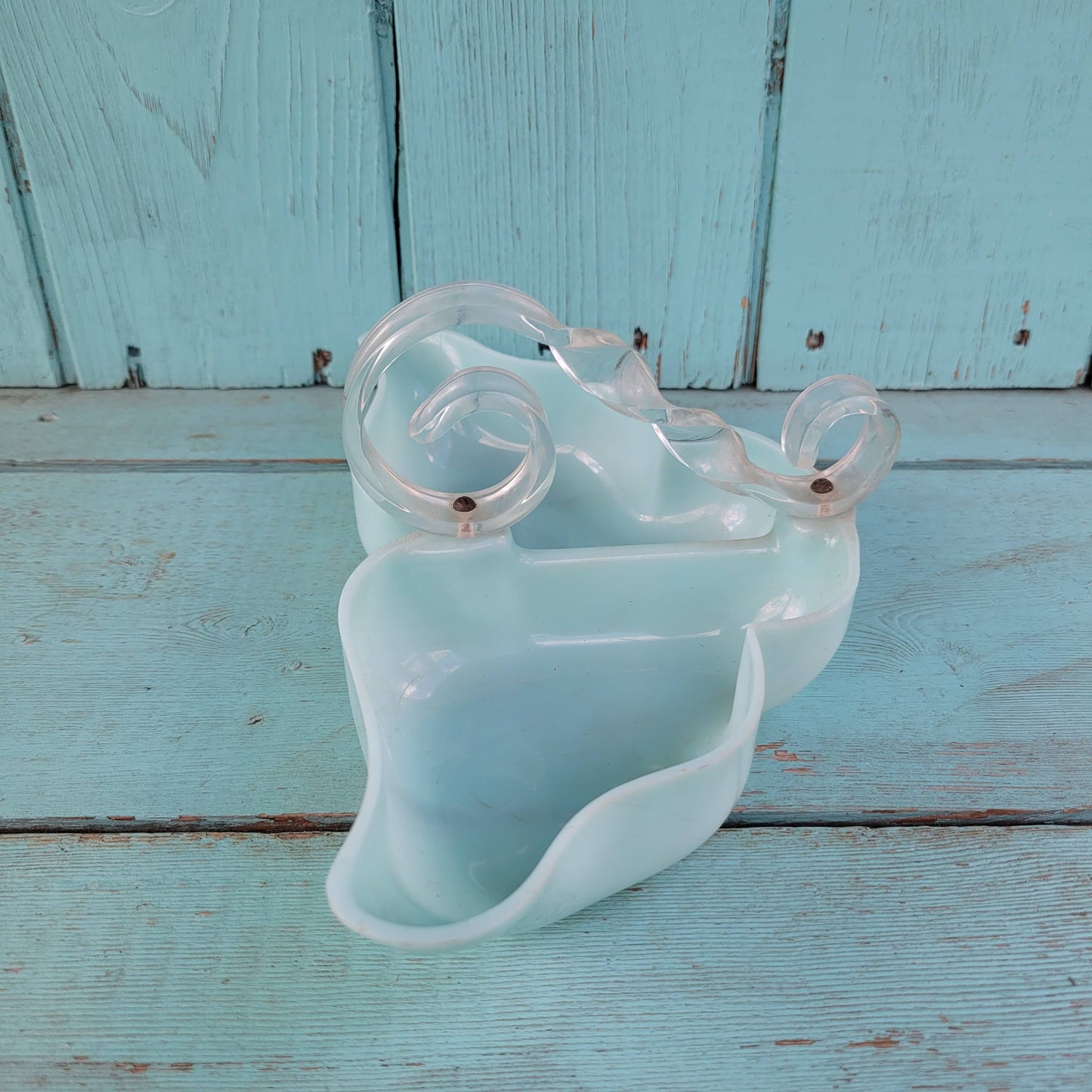 circa. late 1940s pale turquoise acrylic butterfly shaped trinket dish with scroll-shaped handle