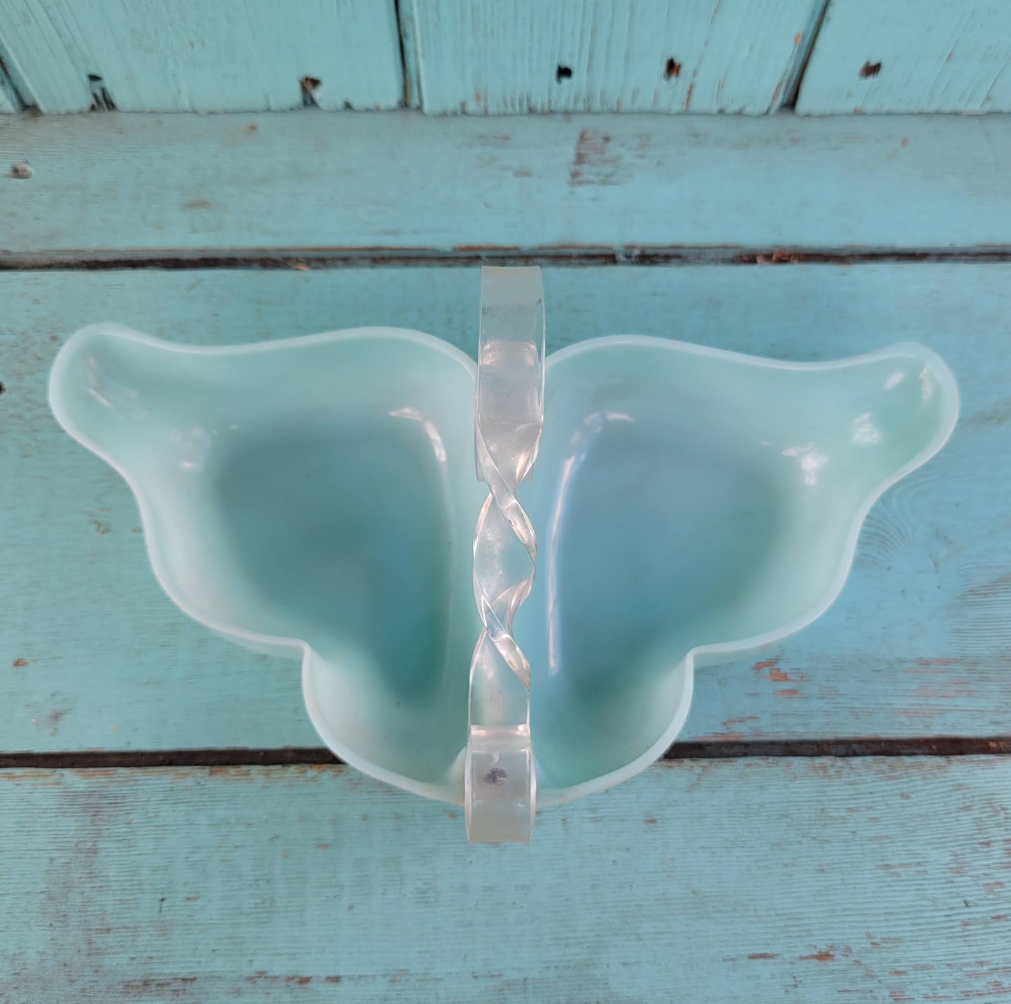 circa. late 1940s pale turquoise acrylic butterfly shaped trinket dish with scroll-shaped handle