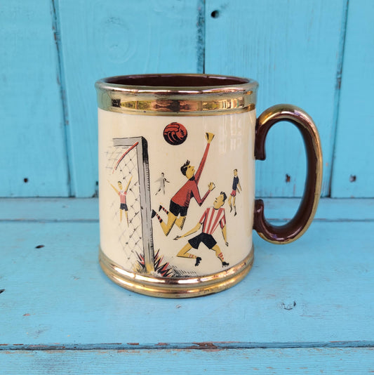 Collectable 1950s Gibsons china tankard with copper gilt edging and football players motif