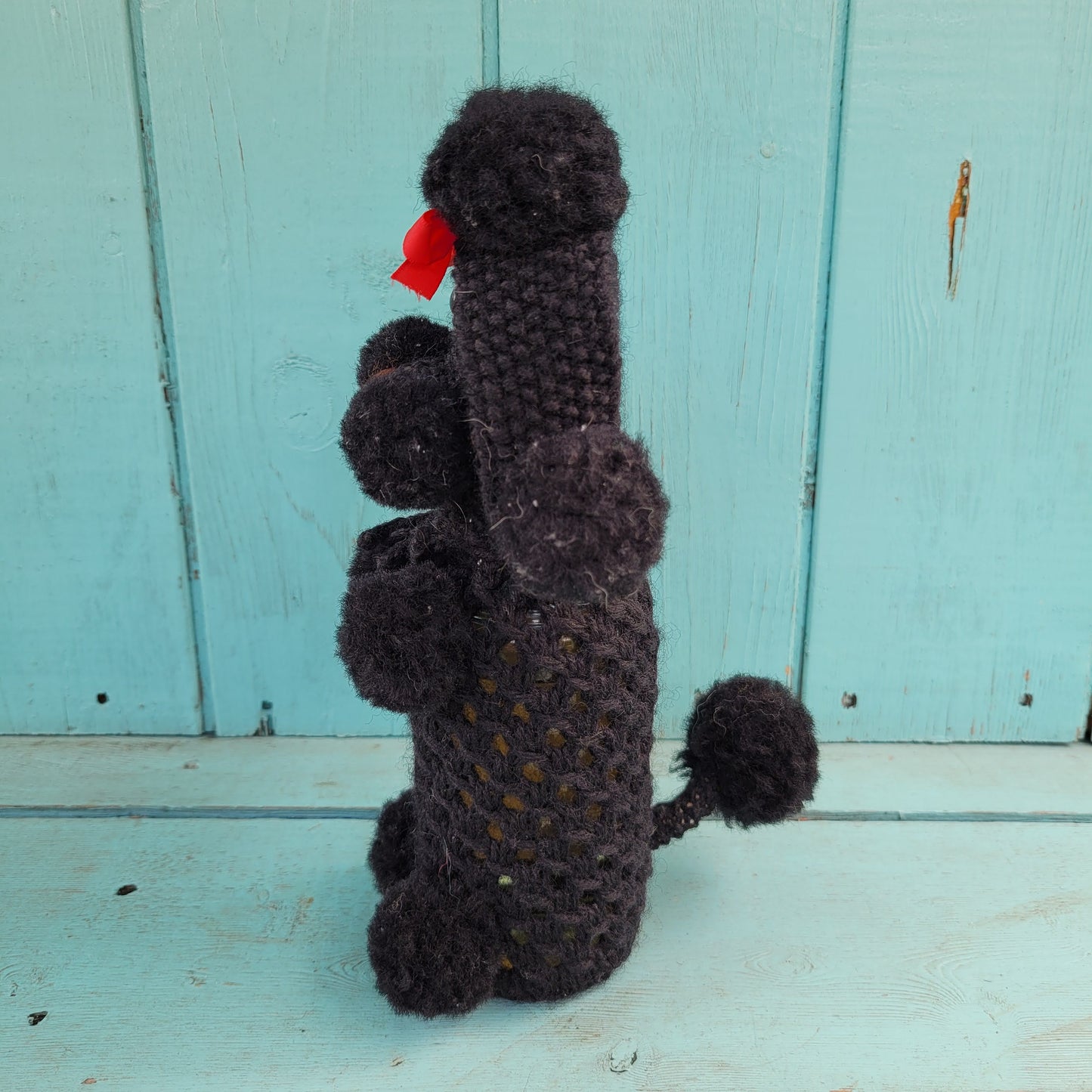 Two 1960s/70s crocheted poodle eau de toilette bottle covers with contents