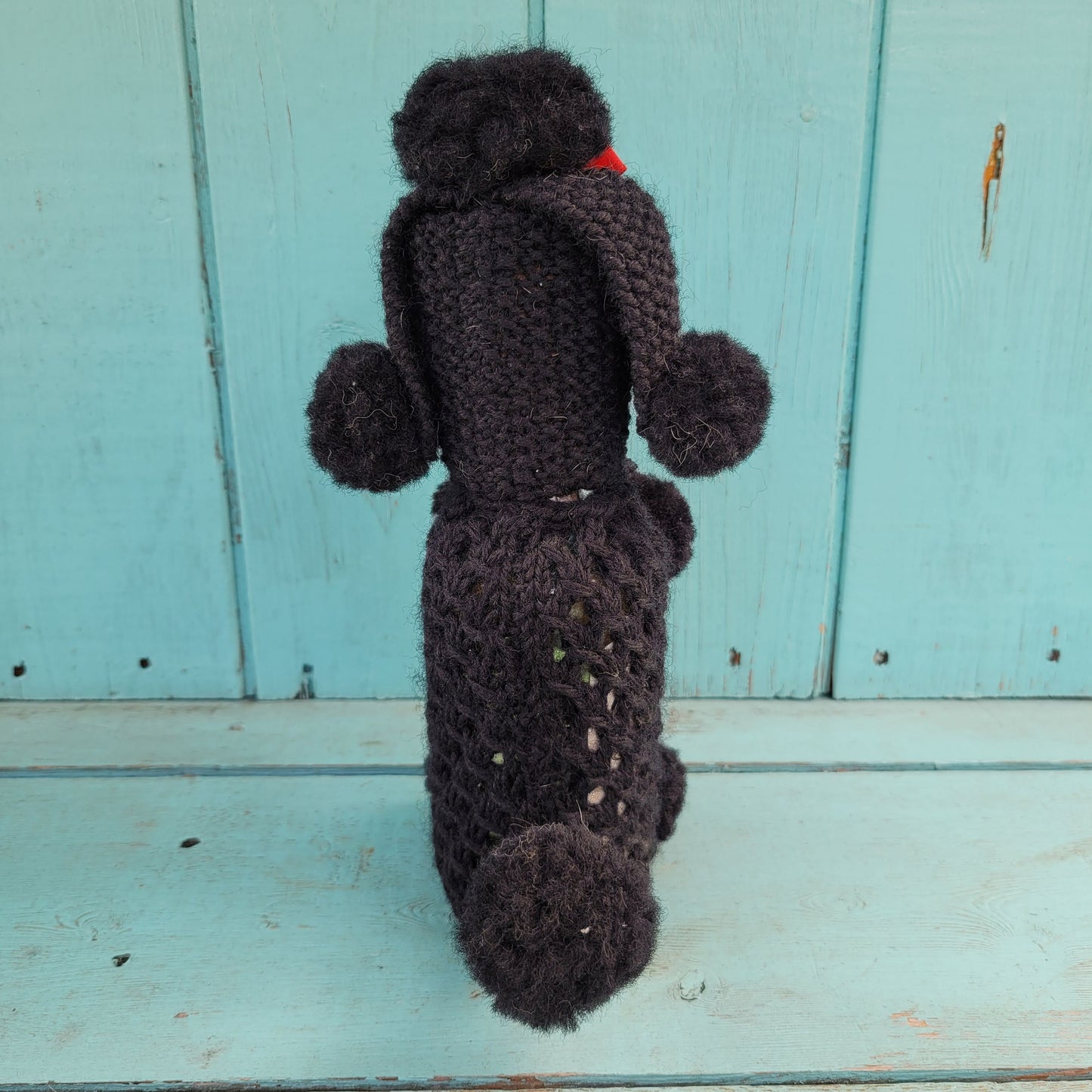 Two 1960s/70s crocheted poodle eau de toilette bottle covers with contents