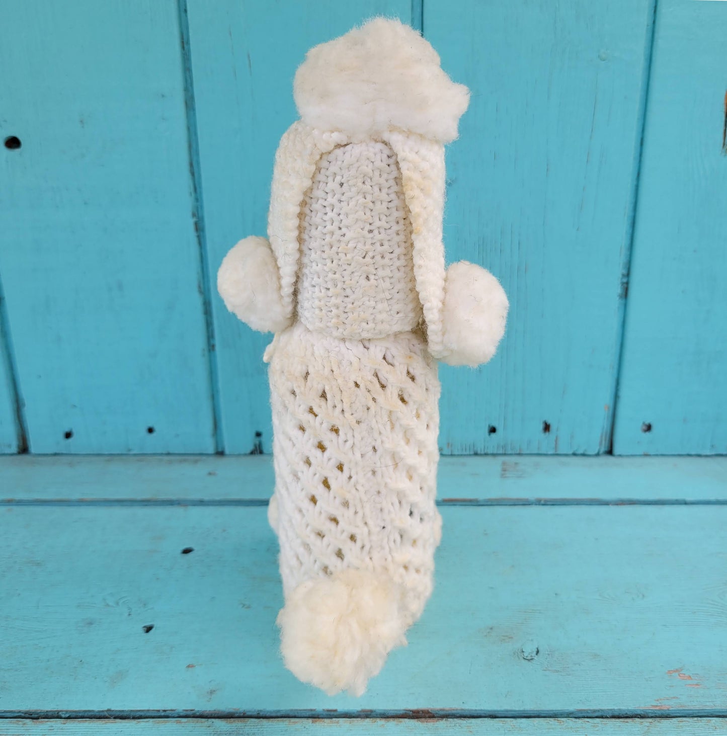 Two 1960s/70s crocheted poodle eau de toilette bottle covers with contents