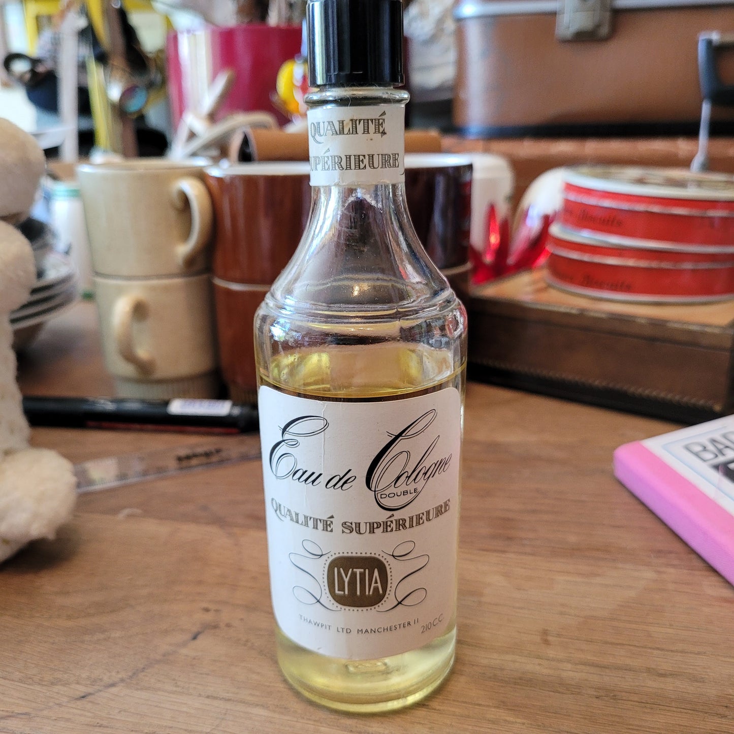 Two 1960s/70s crocheted poodle eau de toilette bottle covers with contents