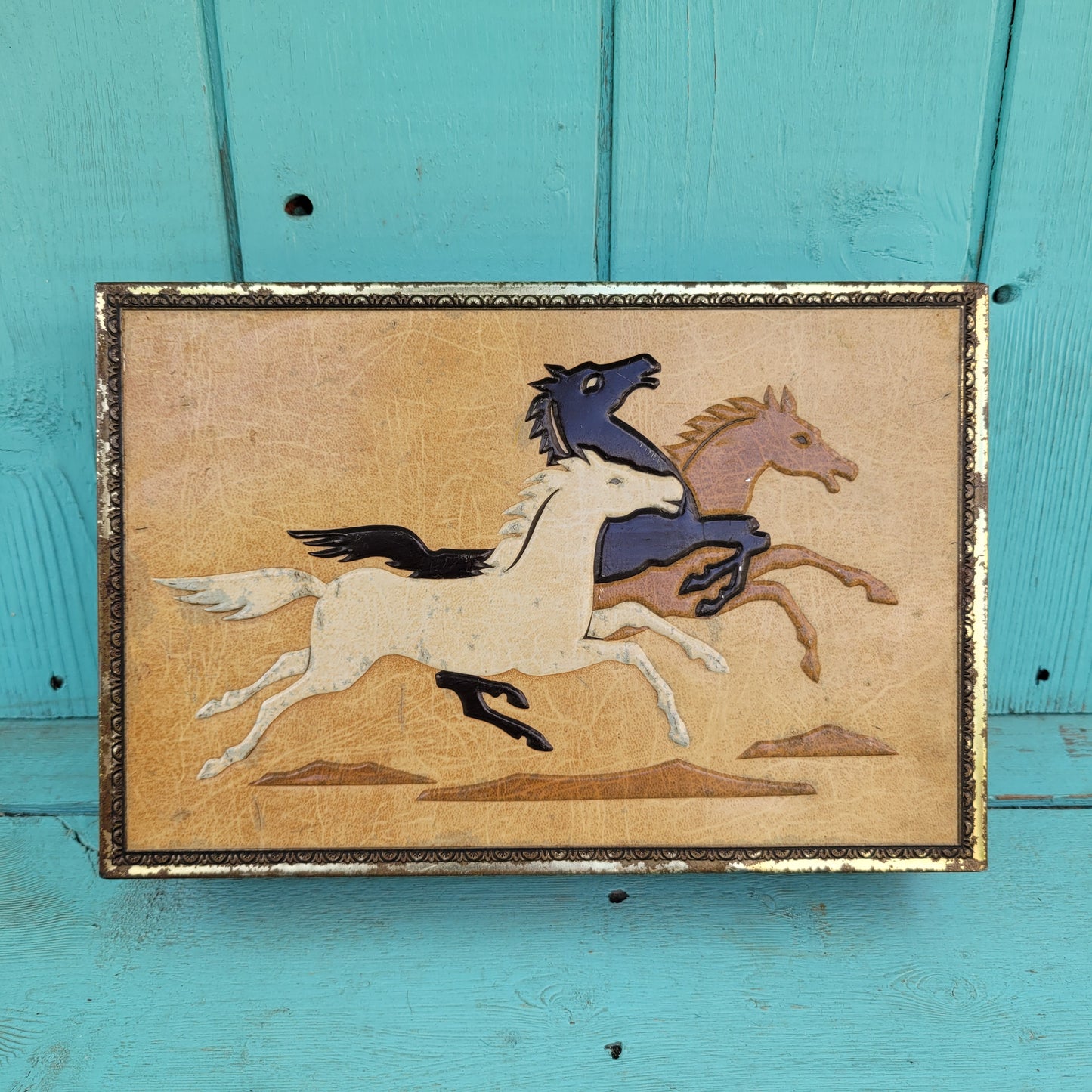 Vintage Chymos, Finland, rectangular candy tin with embossed galloping horses design