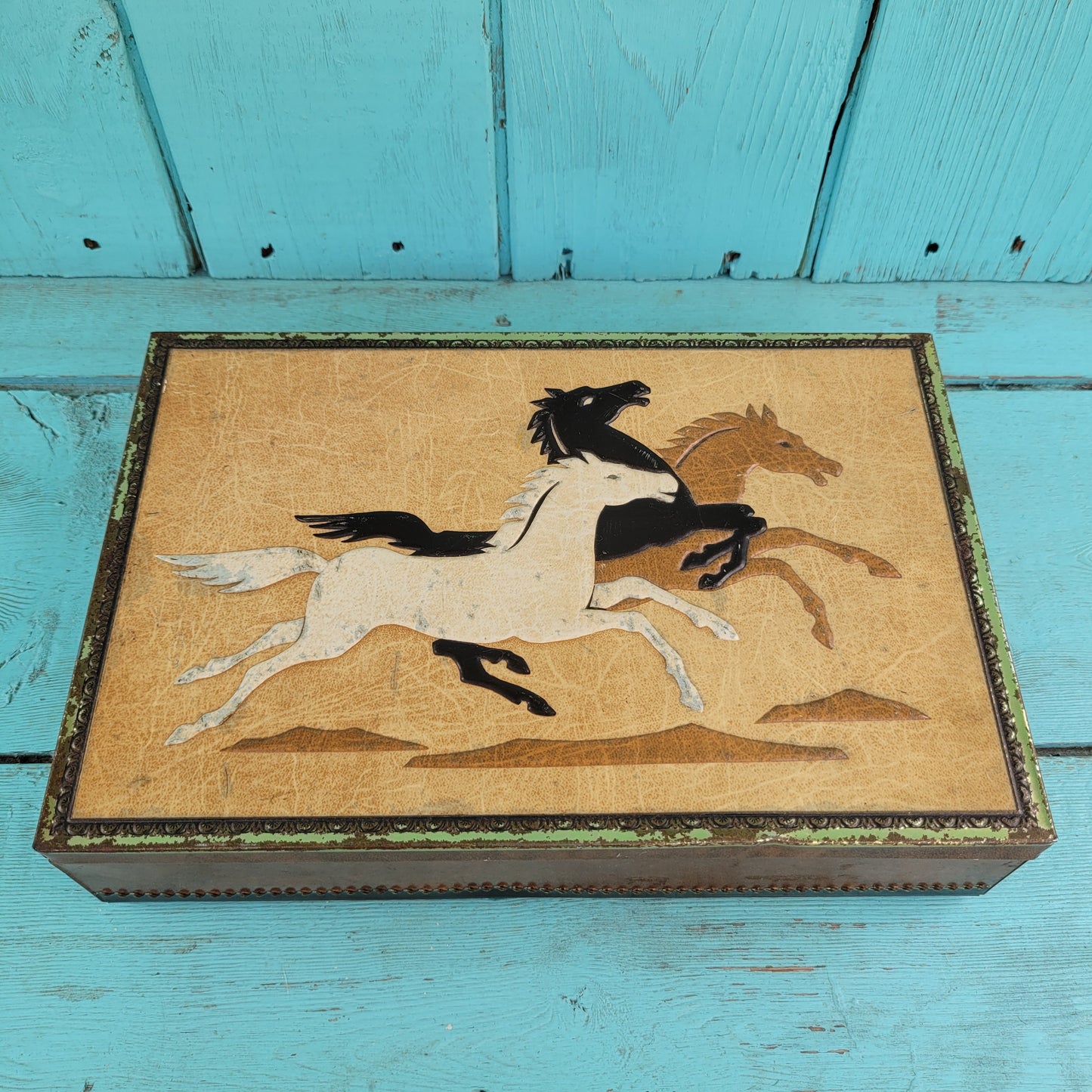 Vintage Chymos, Finland, rectangular candy tin with embossed galloping horses design