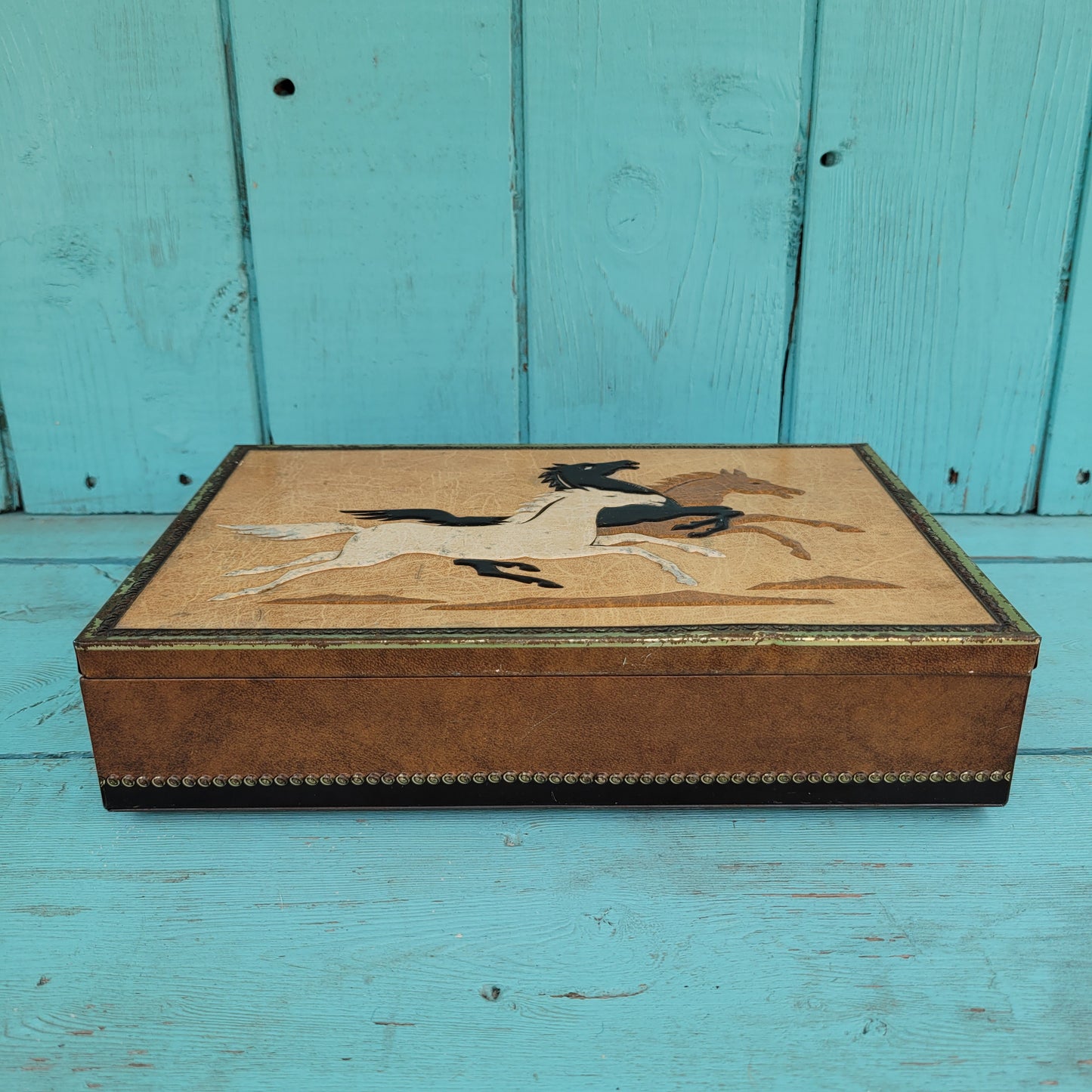 Vintage Chymos, Finland, rectangular candy tin with embossed galloping horses design