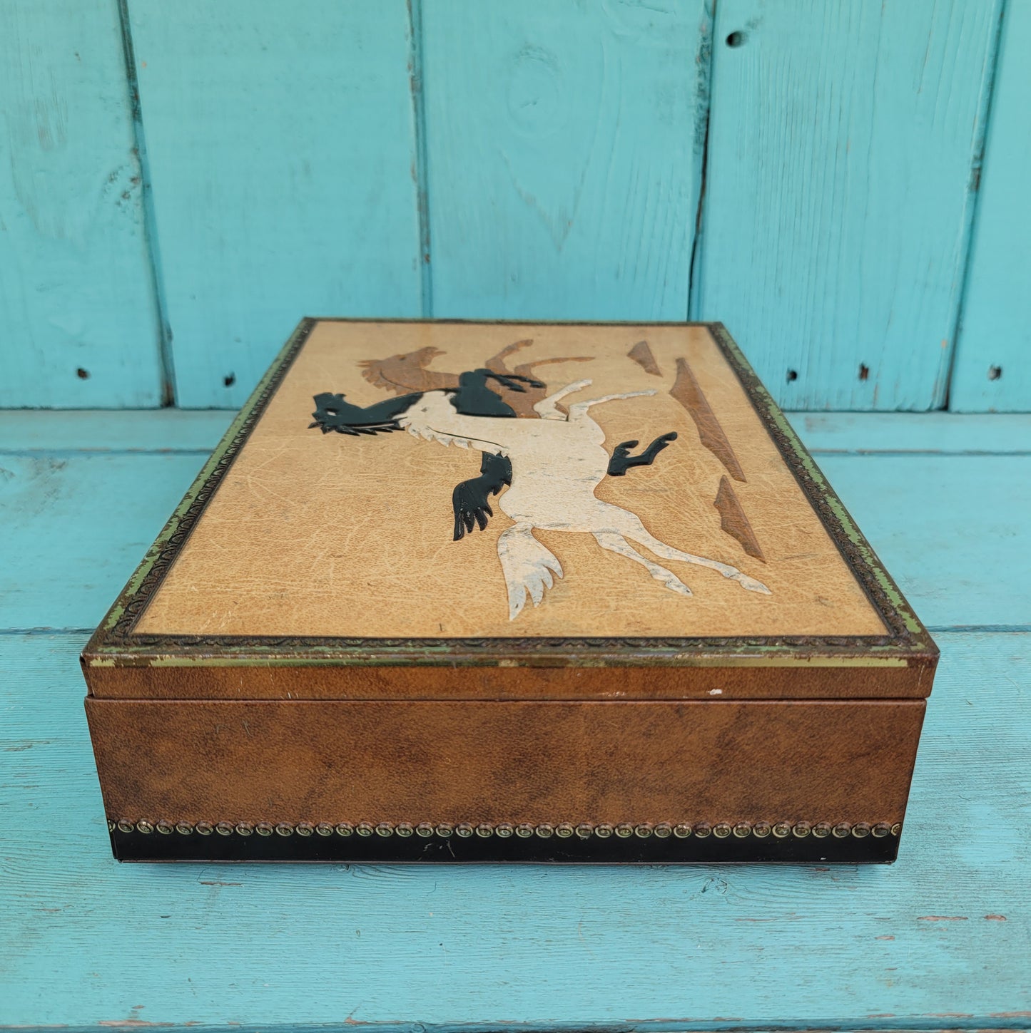 Vintage Chymos, Finland, rectangular candy tin with embossed galloping horses design