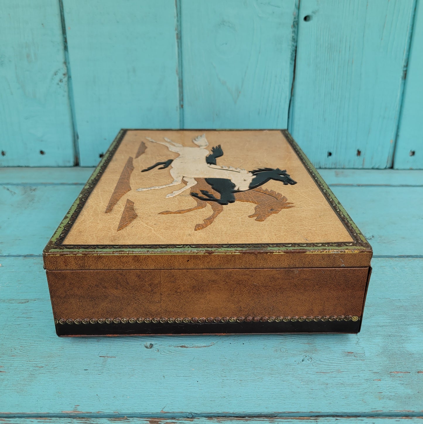 Vintage Chymos, Finland, rectangular candy tin with embossed galloping horses design