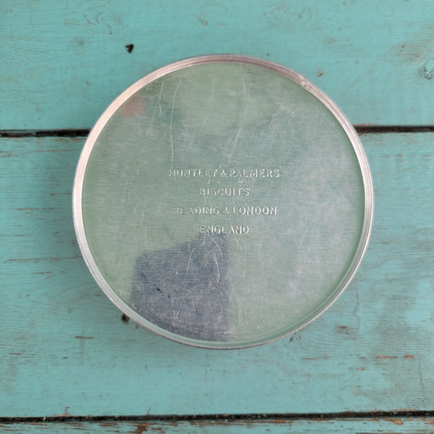 Two 1950s Huntley & Palmer's round mini biscuit tins, Grace the giraffe, and Monty the monkey