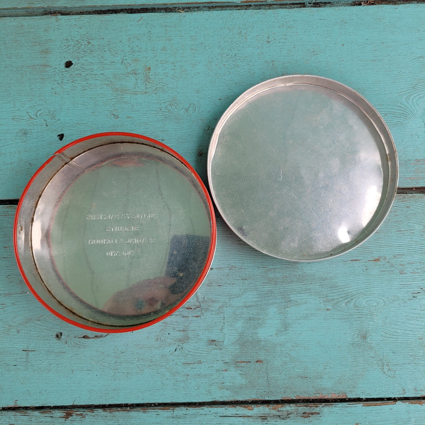 Two 1950s Huntley & Palmer's round mini biscuit tins, Grace the giraffe, and Monty the monkey