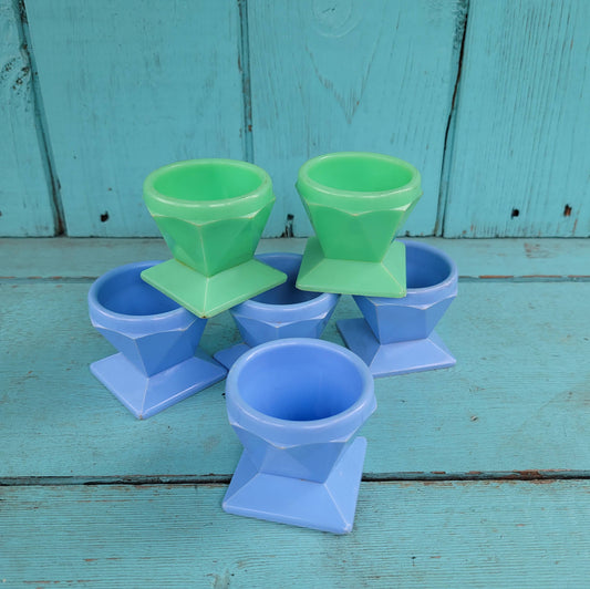 Six 1950s Tudor Rose green, & blue plastic egg cups