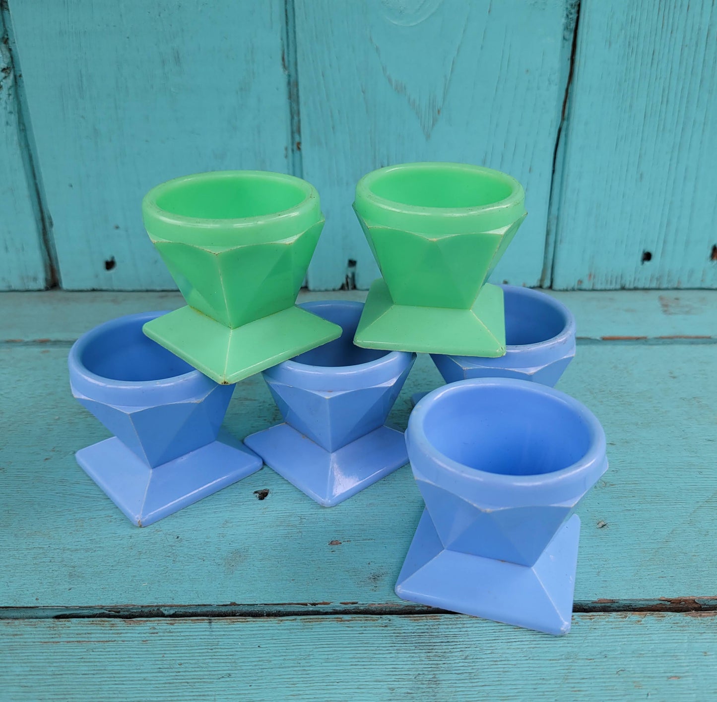 Six 1950s Tudor Rose green, & blue plastic egg cups