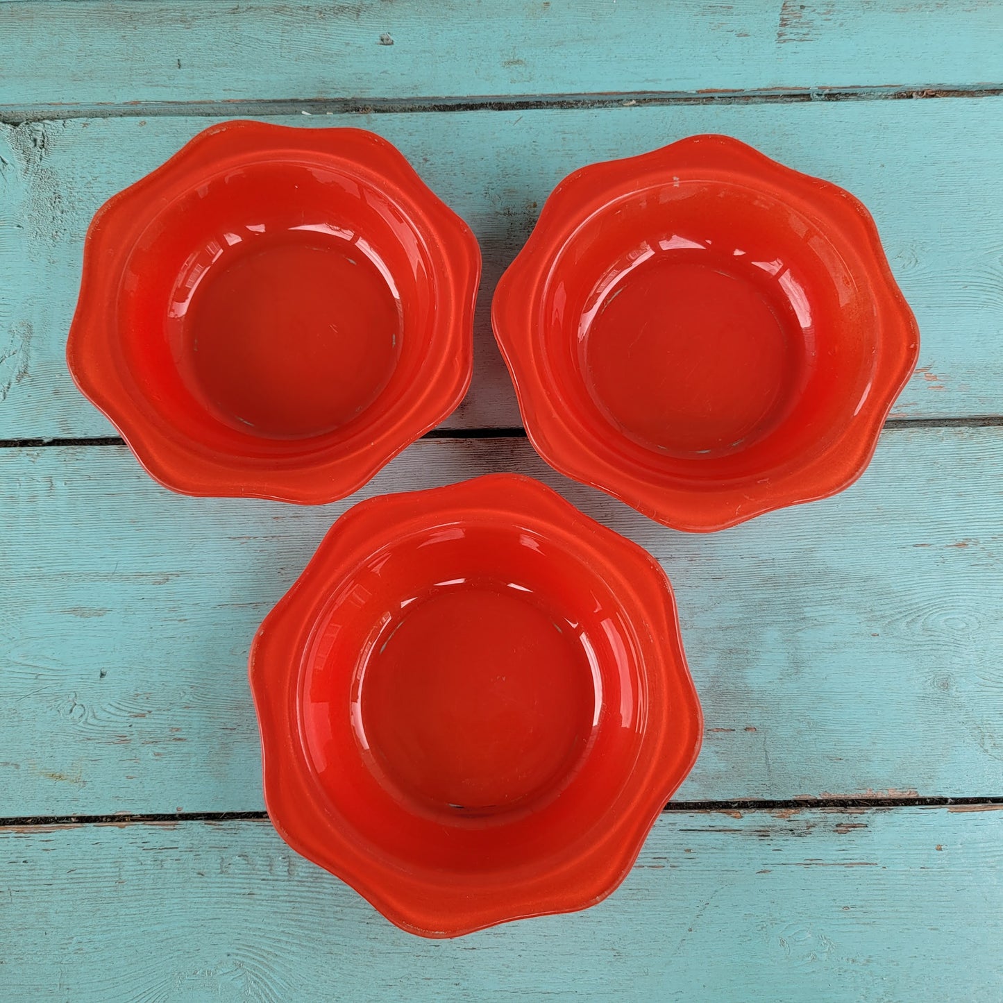 Three 1950s/60s red Pyrex fluted glass dessert bowls