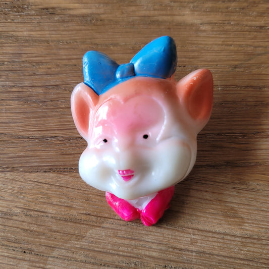 1960s Japanese novelty plastic pig brooch with blue bow