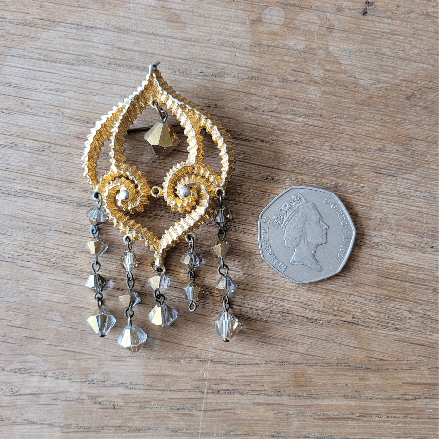 1960s/70s gold-tone filigree chandelier brooch with faceted crystal drops