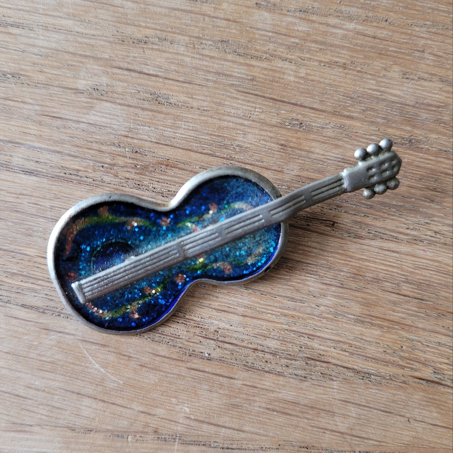 1970s  silver-tone pot metal & blue glitter enamel guitar brooch pin
