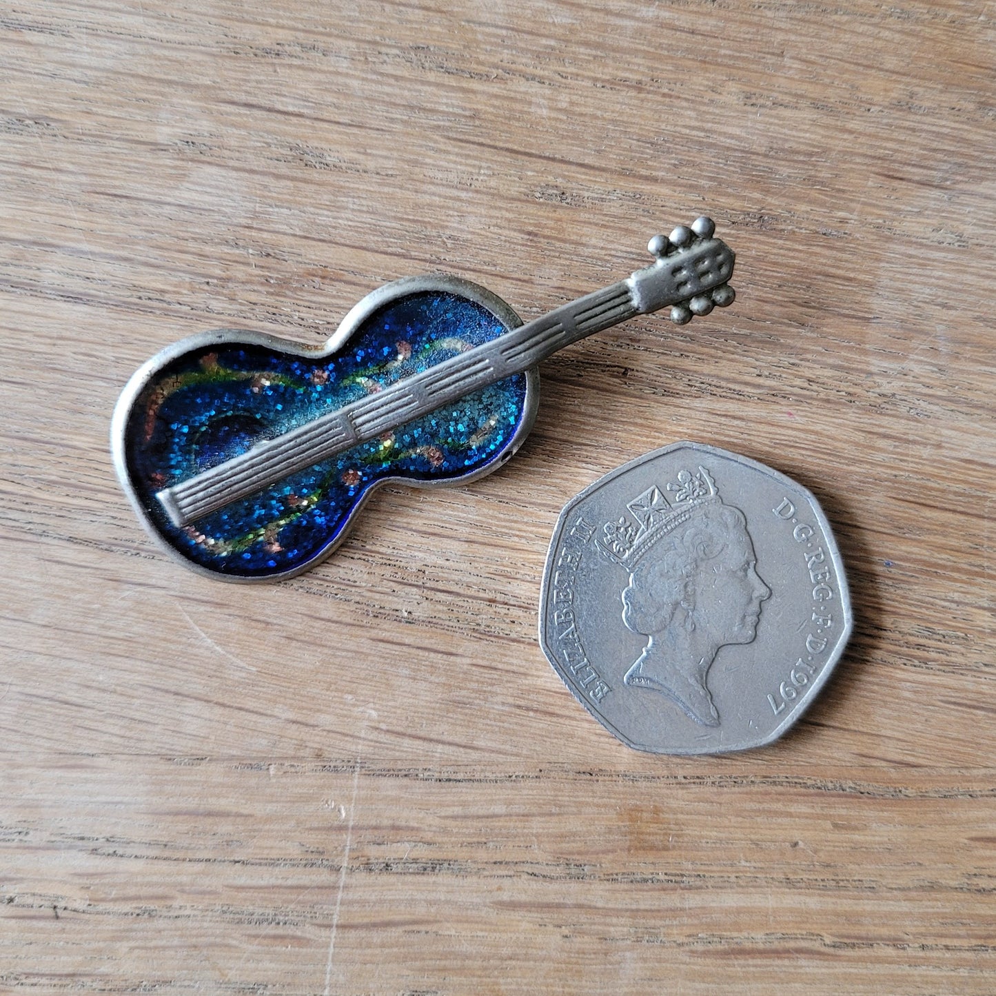 1970s  silver-tone pot metal & blue glitter enamel guitar brooch pin