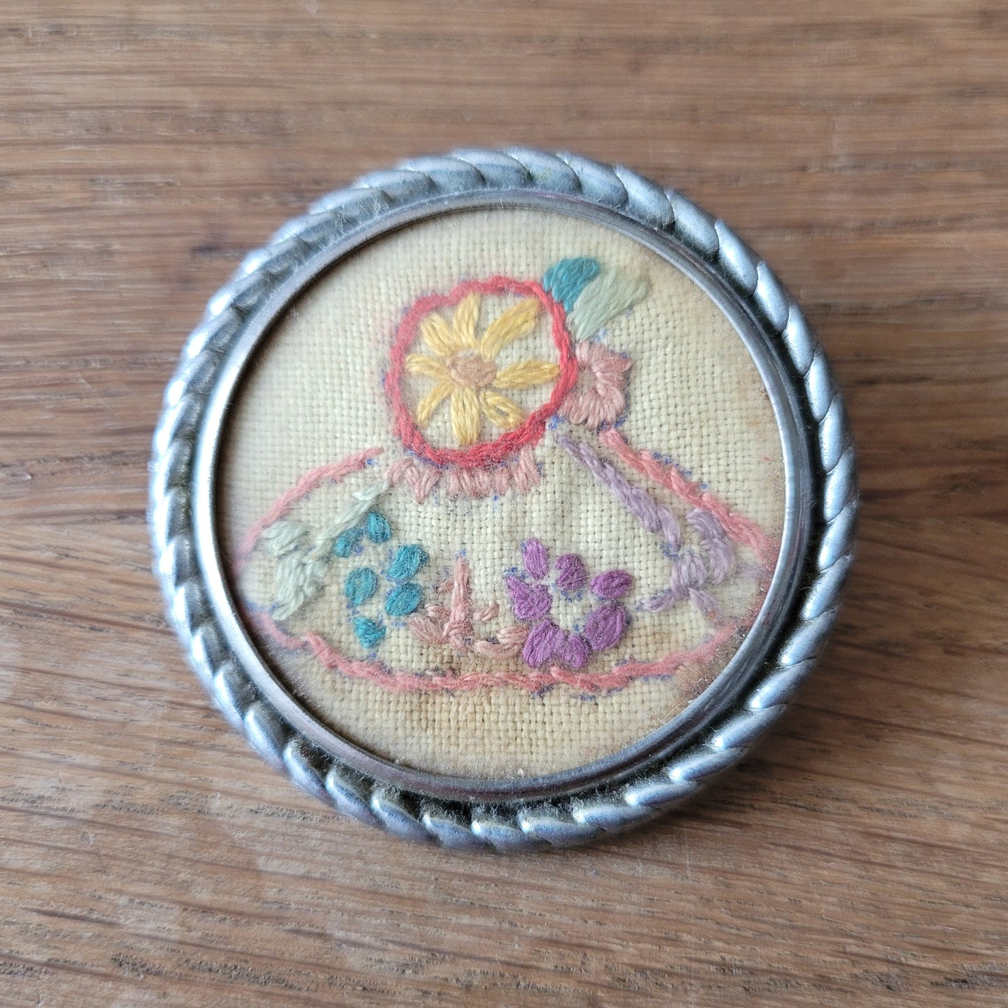 1940s–1950s embroidered crinoline lady silver-tone round brooch