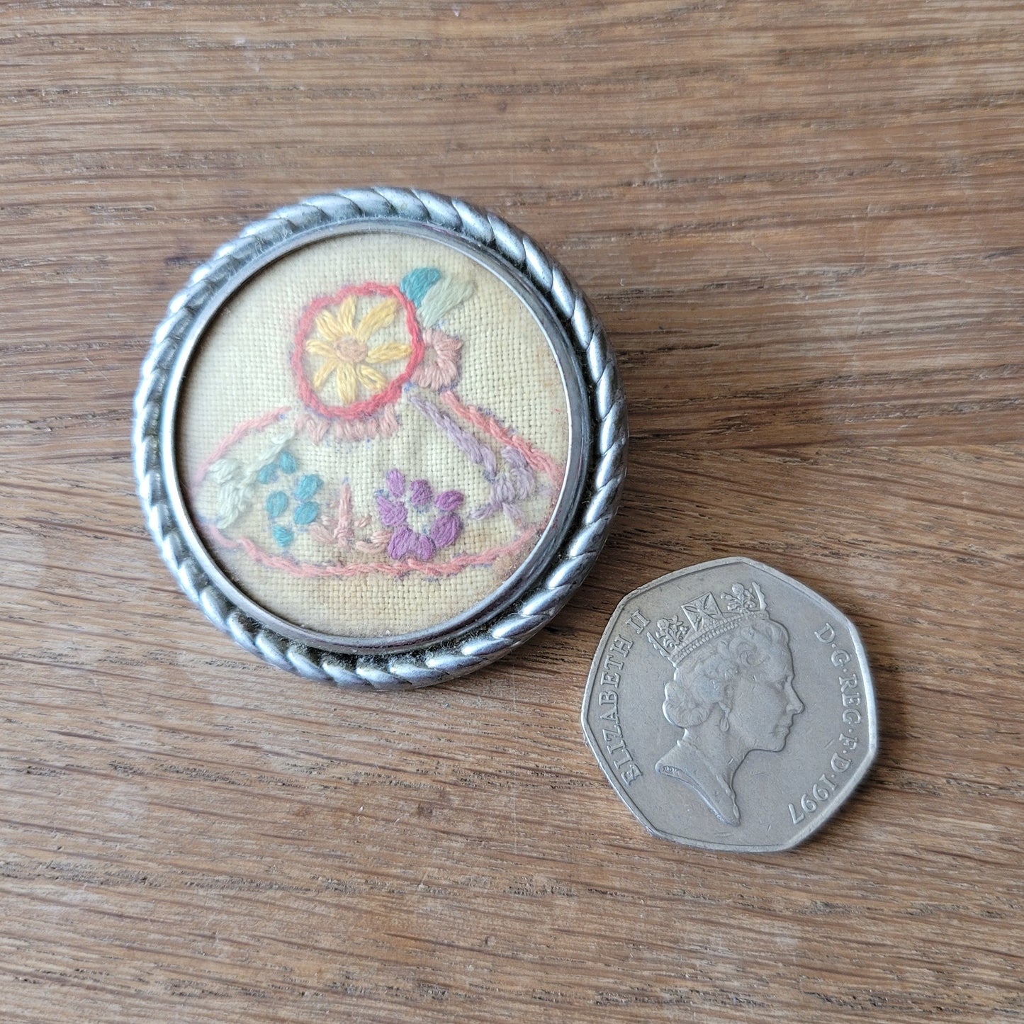 1940s–1950s embroidered crinoline lady silver-tone round brooch