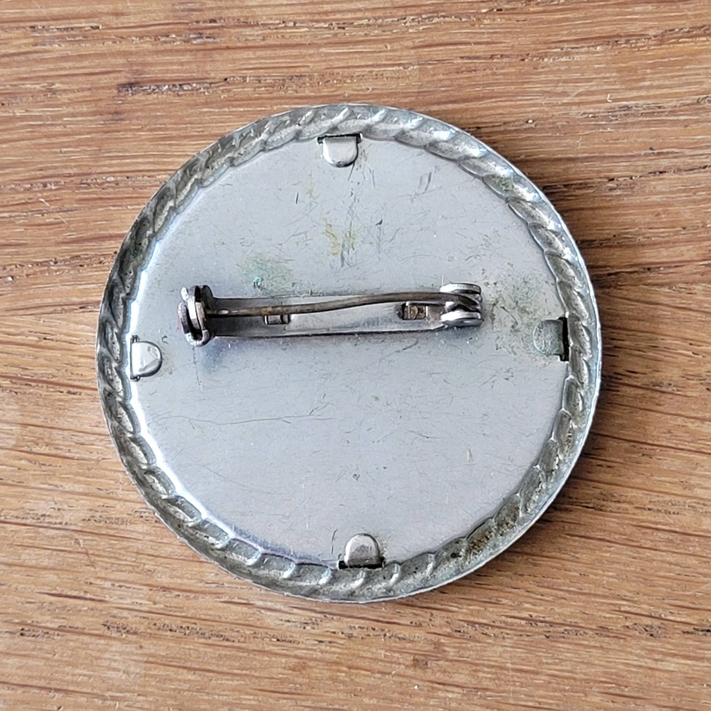 1940s–1950s embroidered crinoline lady silver-tone round brooch