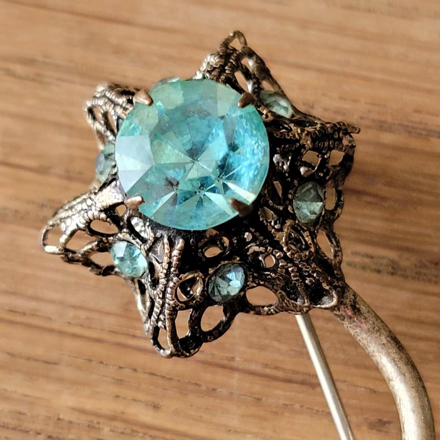 1960s turquoise rhinestone floral spray brooch with filigree detail