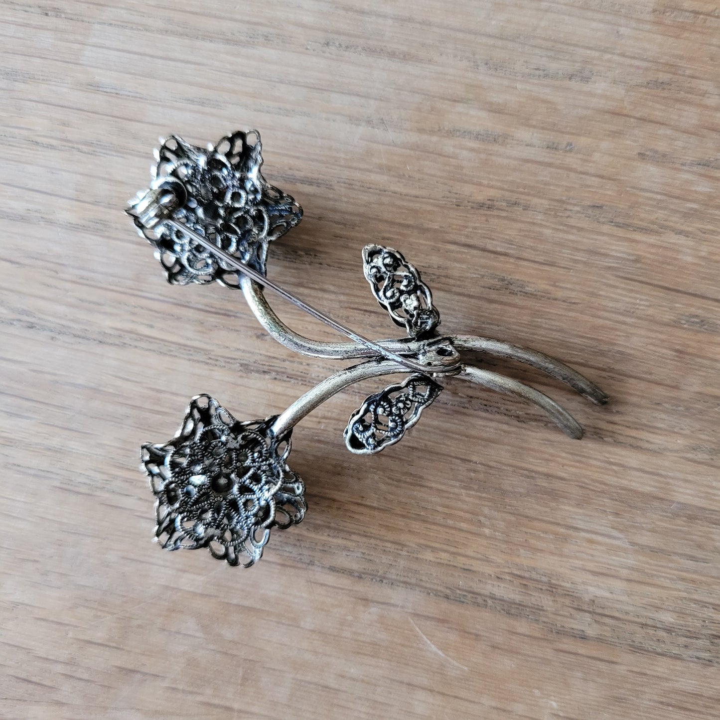 1960s turquoise rhinestone floral spray brooch with filigree detail