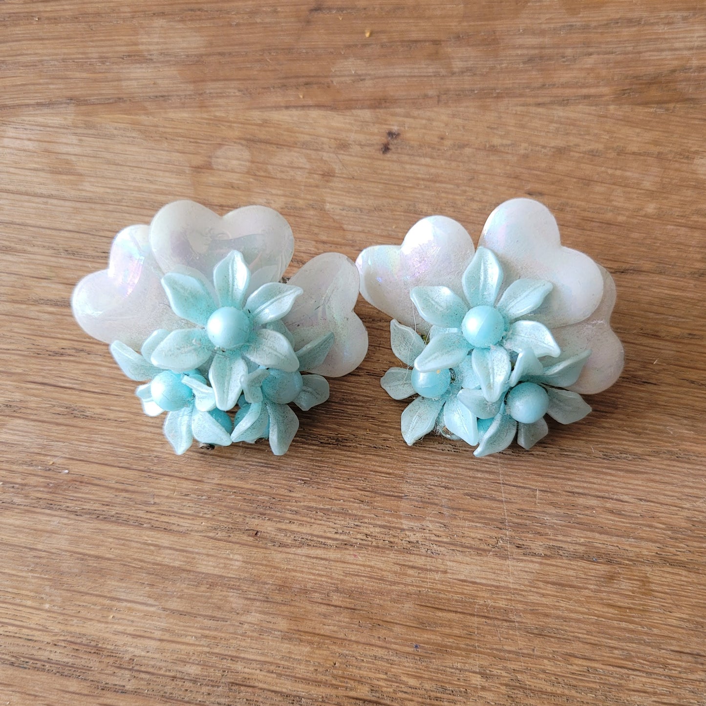 1960s blue floral plastic cluster & iridescent backing clip-on earrings