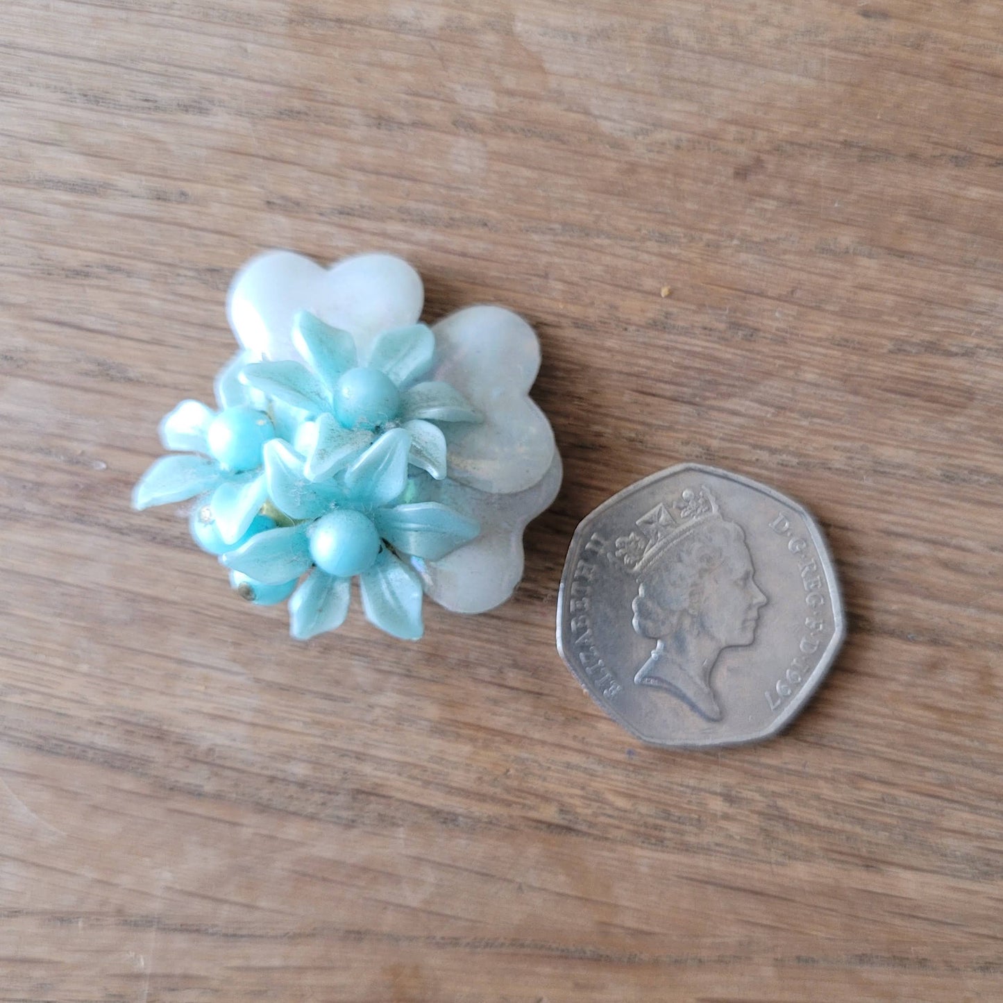 1960s blue floral plastic cluster & iridescent backing clip-on earrings