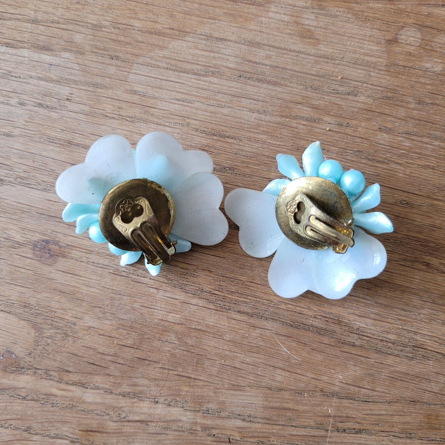 1960s blue floral plastic cluster & iridescent backing clip-on earrings