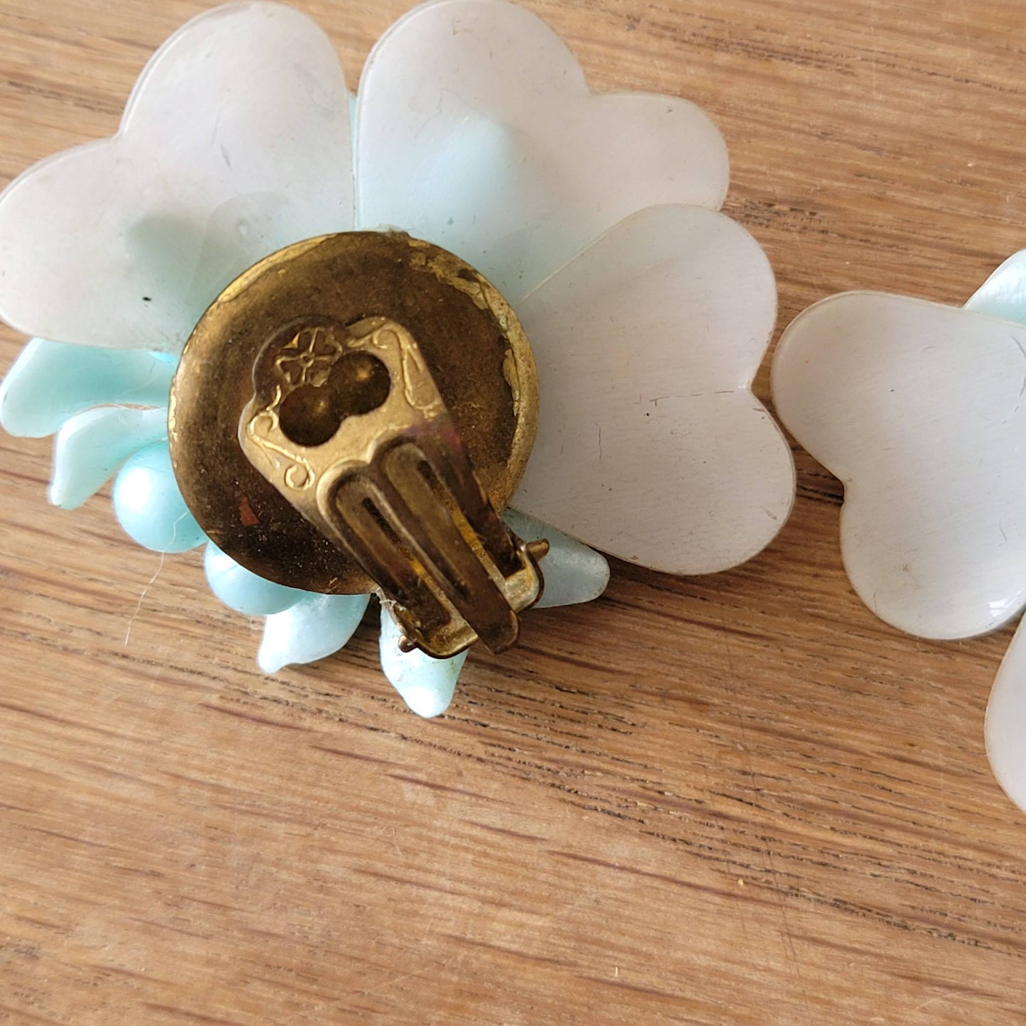 1960s blue floral plastic cluster & iridescent backing clip-on earrings