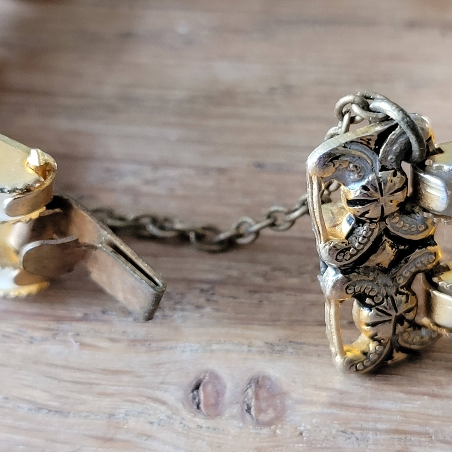 1950s/60s gold-tone ornate link bracelet with lucite panels & safety chain
