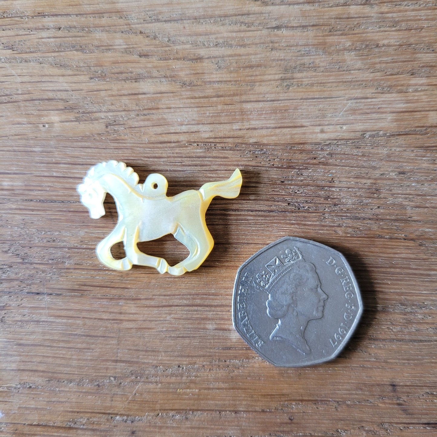 circa. 1960s carved Mother of Pearl stylised horse pendant