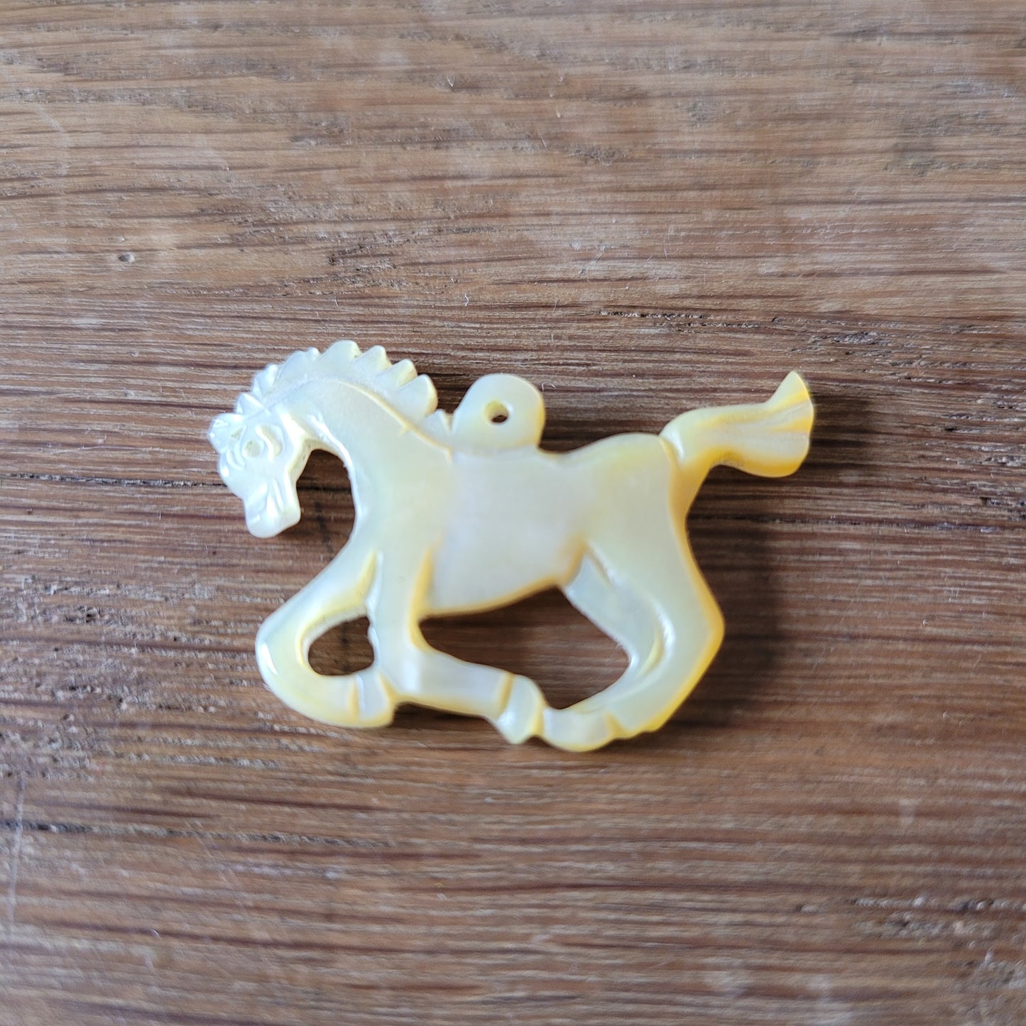 circa. 1960s carved Mother of Pearl stylised horse pendant