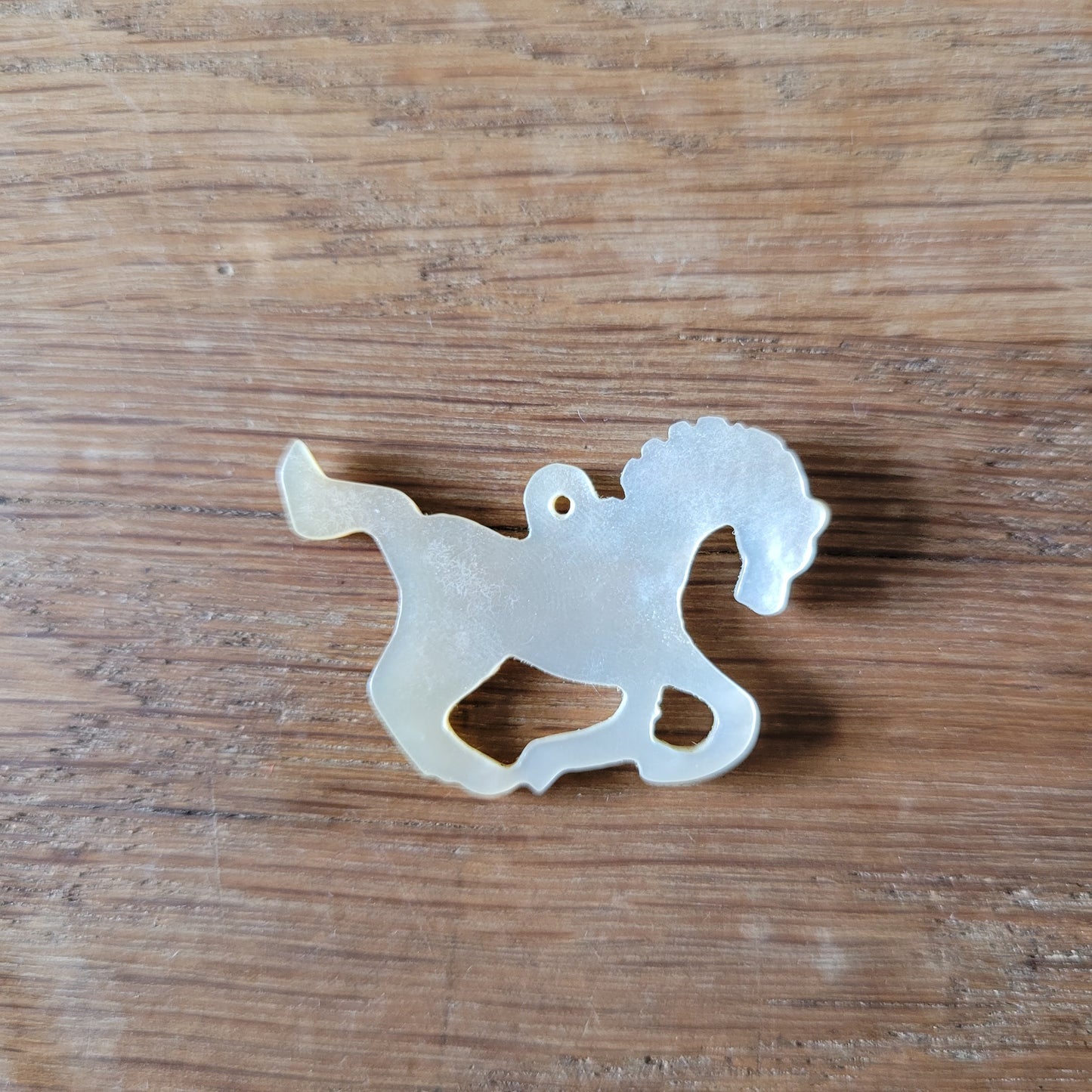 circa. 1960s carved Mother of Pearl stylised horse pendant
