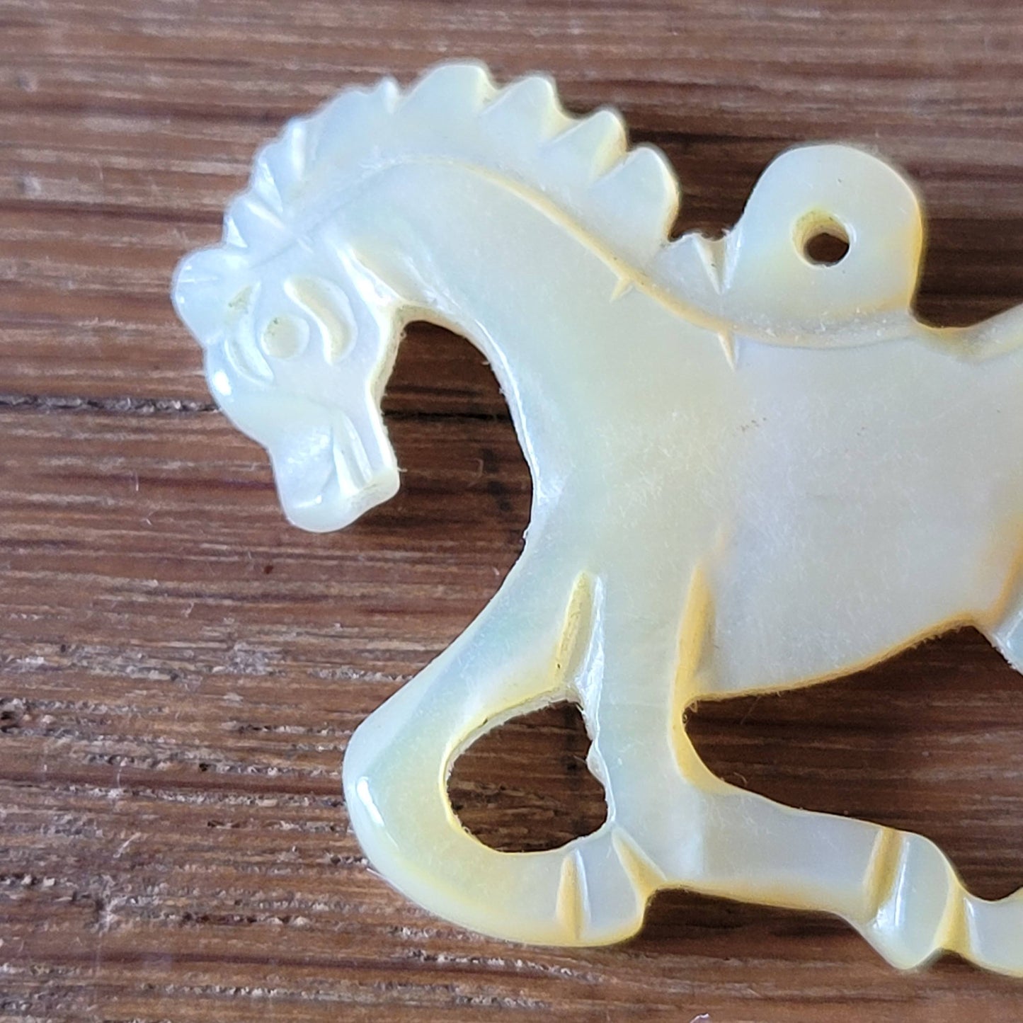 circa. 1960s carved Mother of Pearl stylised horse pendant