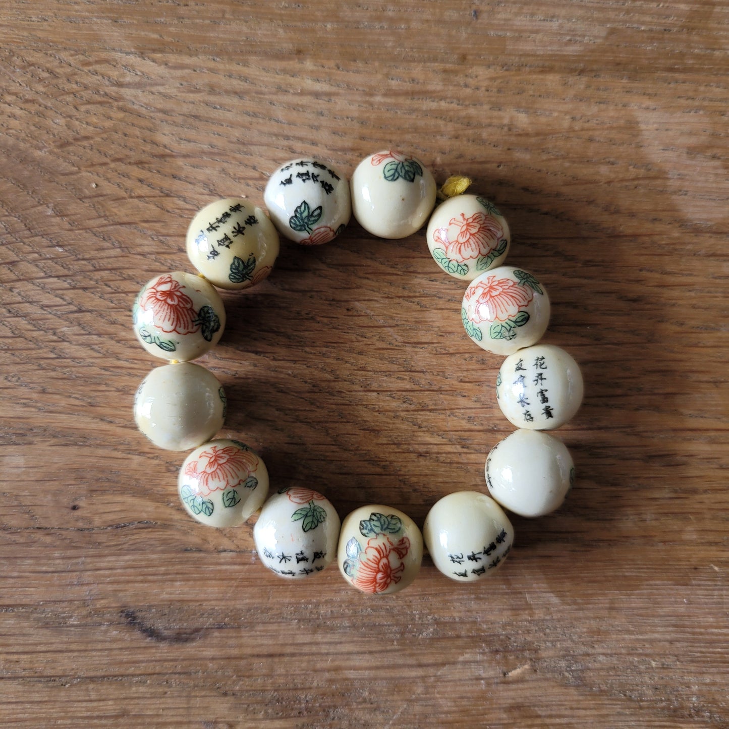 Vintage Chinese-style ceramic bead bracelet with floral motif and calligraphy detail